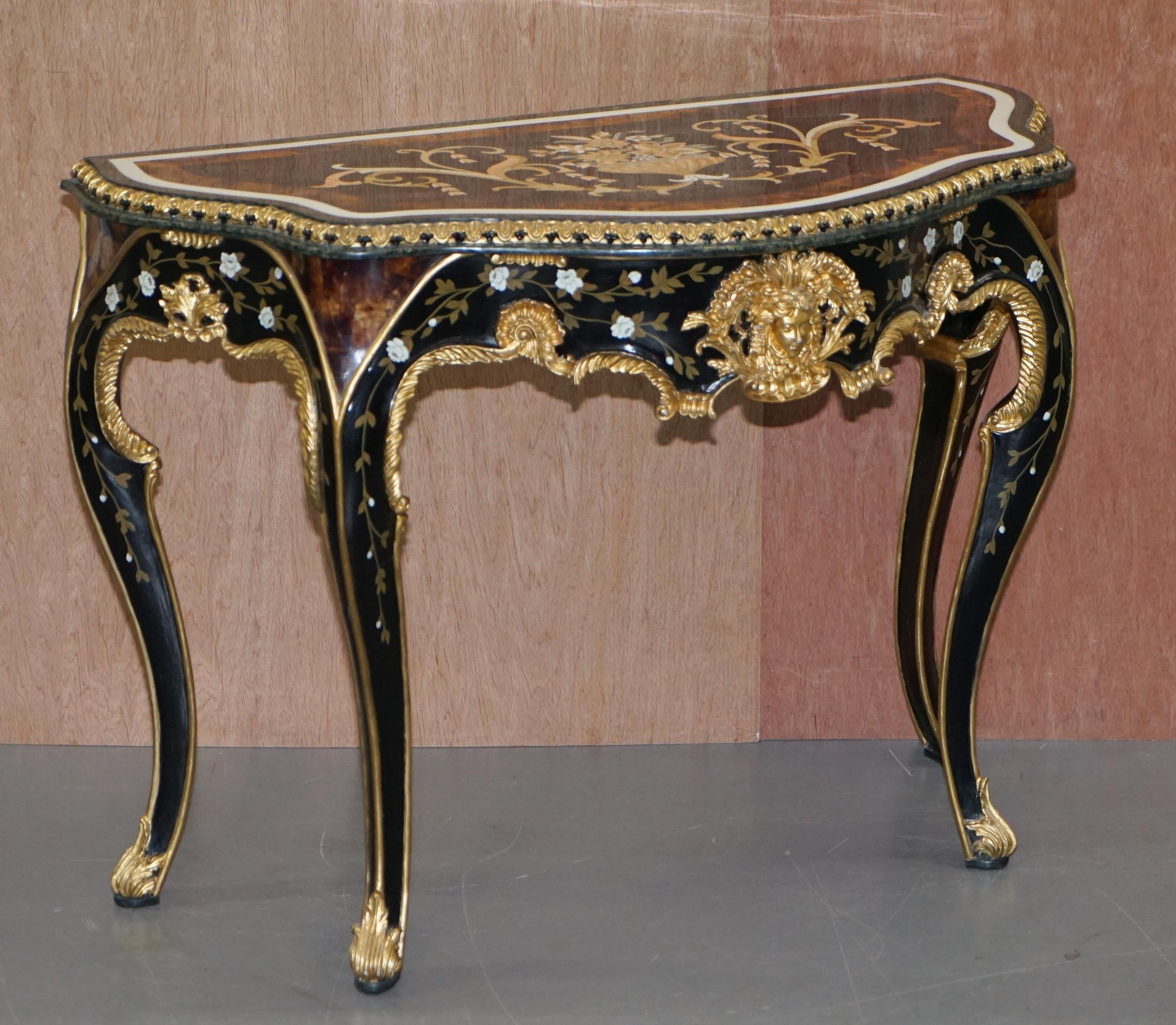 We are delighted to offer for sale this sublime pair of very important vintage Pietra Dura Marble Italian console tables with gold giltwood and bronze detailing

This pair are simply put the most ornate Piertra Dura pieces I have ever seen, they