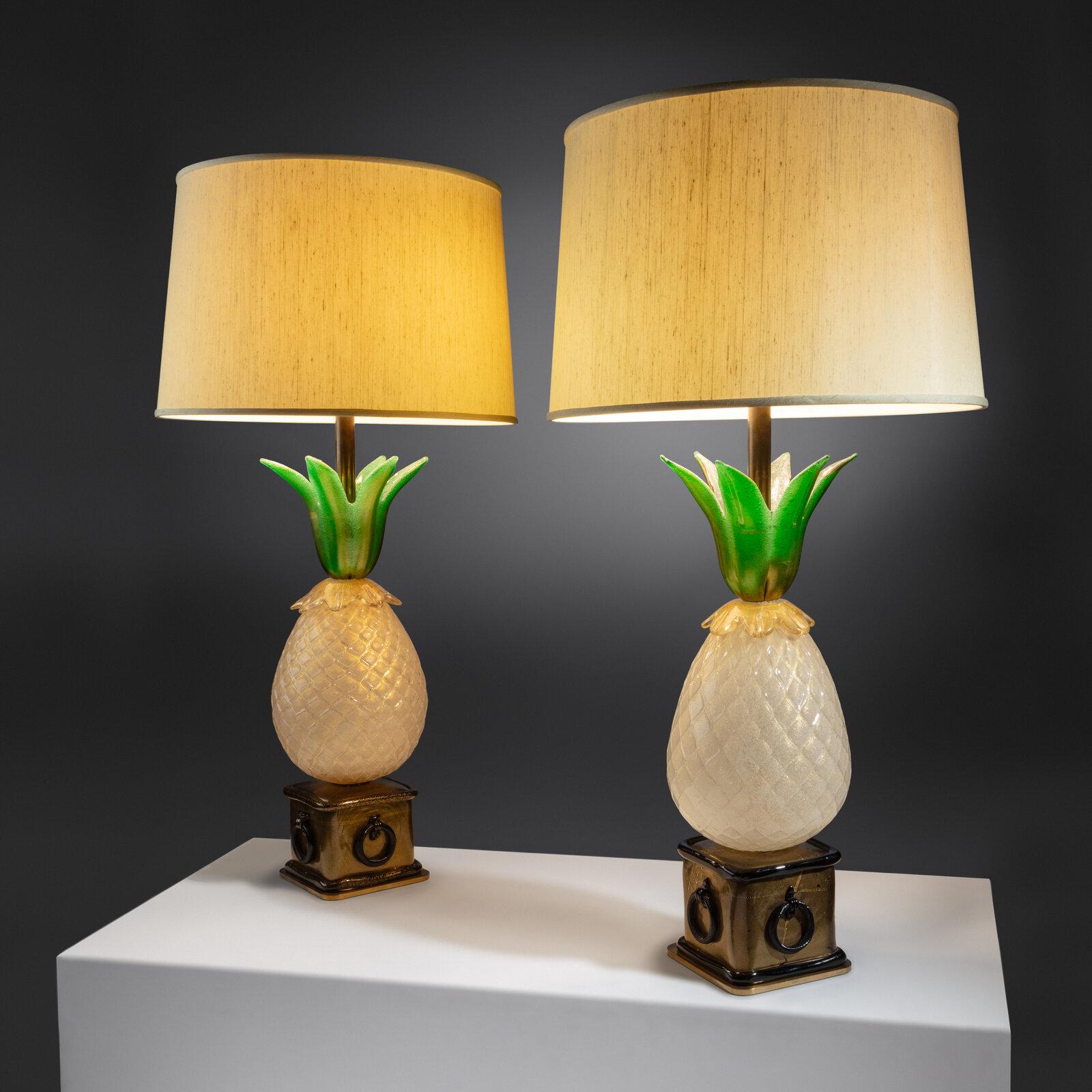 Important pair of pineapple-form Murano glass table lamps resting on brass bases by Barovier e Toso, Italy: circa 1950. A similar example of this pair of lamps is shown in the Elvis Movie Jail house Rock .The pineapple lamp is an iconic design by