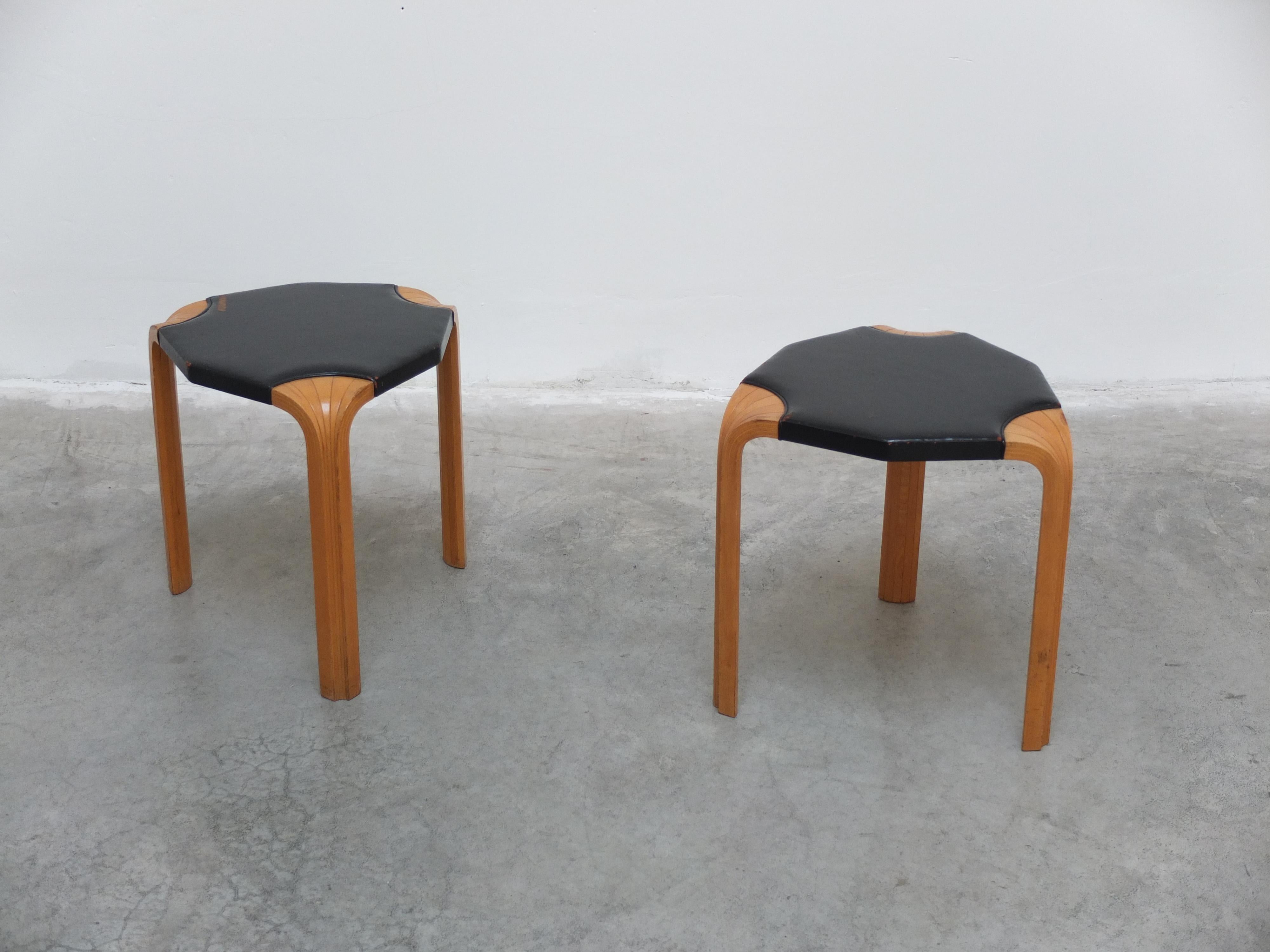 Very rare pair of model ‘X602’ stools designed by Alvar Aalto around 1954. Made of a birch tripod base with exceptional wood detailing and the original black leather seats. In great original condition with unique patina. Manufactured in Finland by