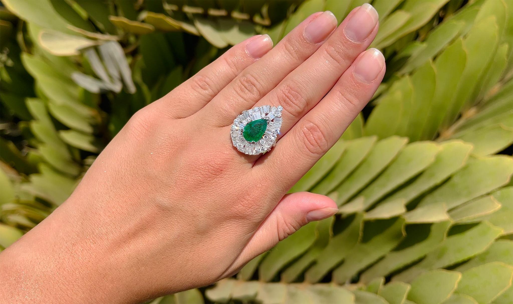Important Pear Shaped Emerald Ring Set In Diamond Setting. The setting is made from 46 Baguette Diamonds & 43 Round Diamonds.
It comes with an appraisal by GIA G.G.

Pear Emerald = 2.25 Carat
Total Carat Weight of Diamonds is 3.45 Carats
Diamonds