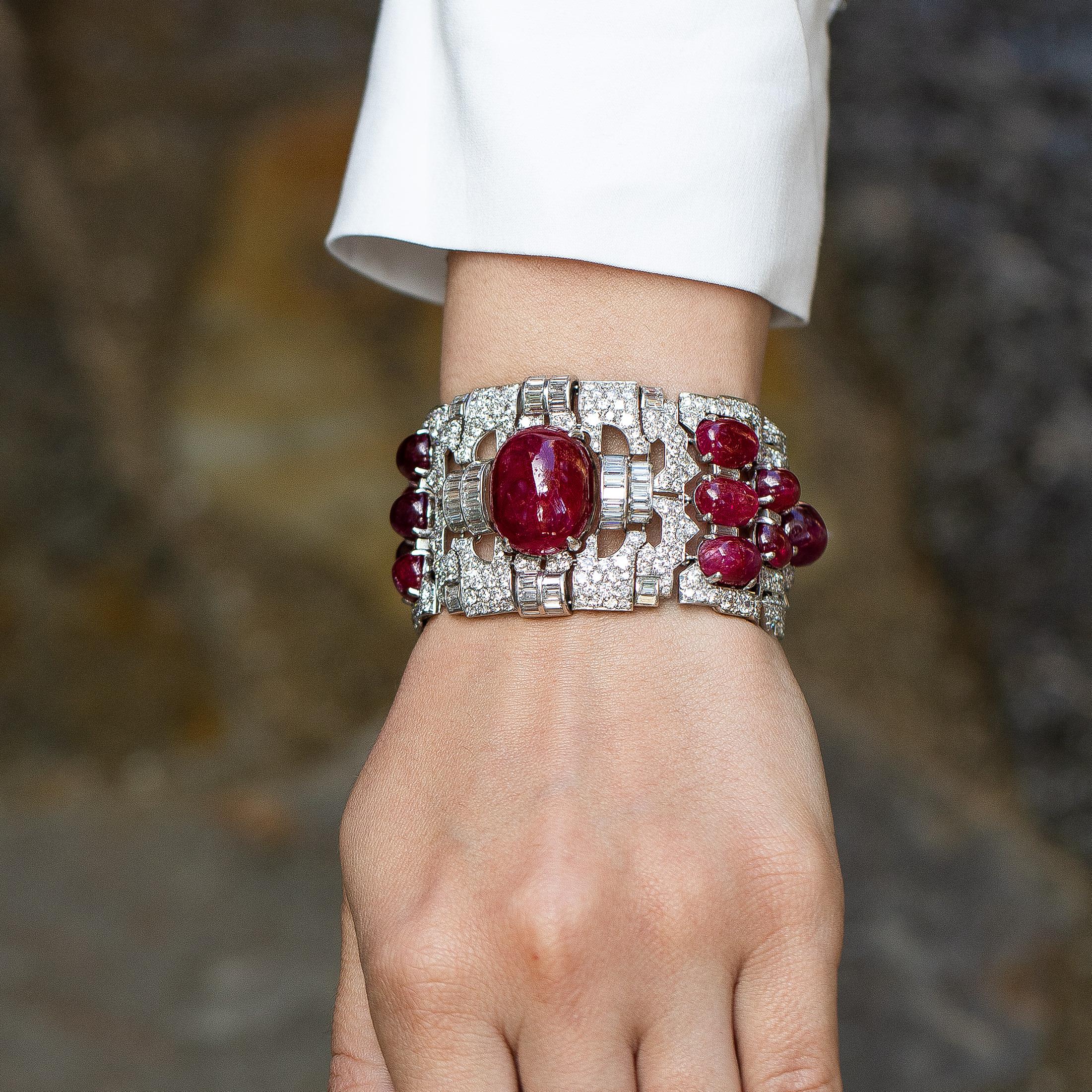 Very Important Ruby & Diamond Bracelet.
Cabochon Rubies = 60+ carats
Diamonds = 38.65 carats
( Color: F, Clarity: VS )
Metal: Platinum
Period: Art Deco
Length = 7 Inches
Jewelry Gift Box Included