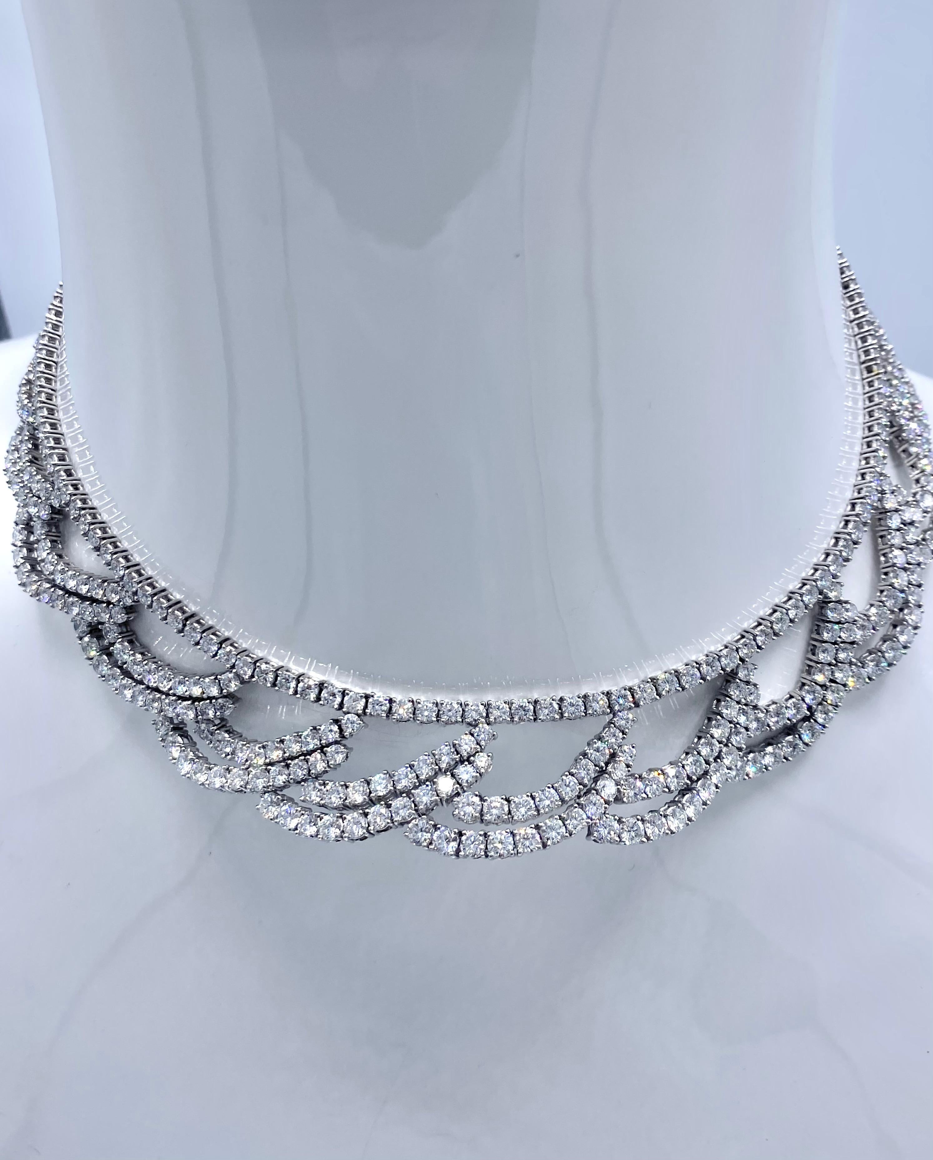 Beautiful platinum necklace inlaid with 453 round brilliant cut diamonds. Total approx. weight of 30cts, approx. Color Very white Clean stones E/F, approx. Clarity of VS1. Stamped, PT950 to exterior of clasp, and, 750 to interior of closure.  weight