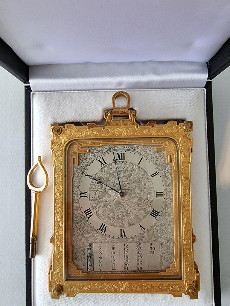 Antique Thomas Cole strut clock with calendar. High quality strut clock by this eminent maker. Early model being pre-numbered. In leather carry case. Retailed by Hunt & Roskell and signed by them on the dial. The multi layered case, in the typical