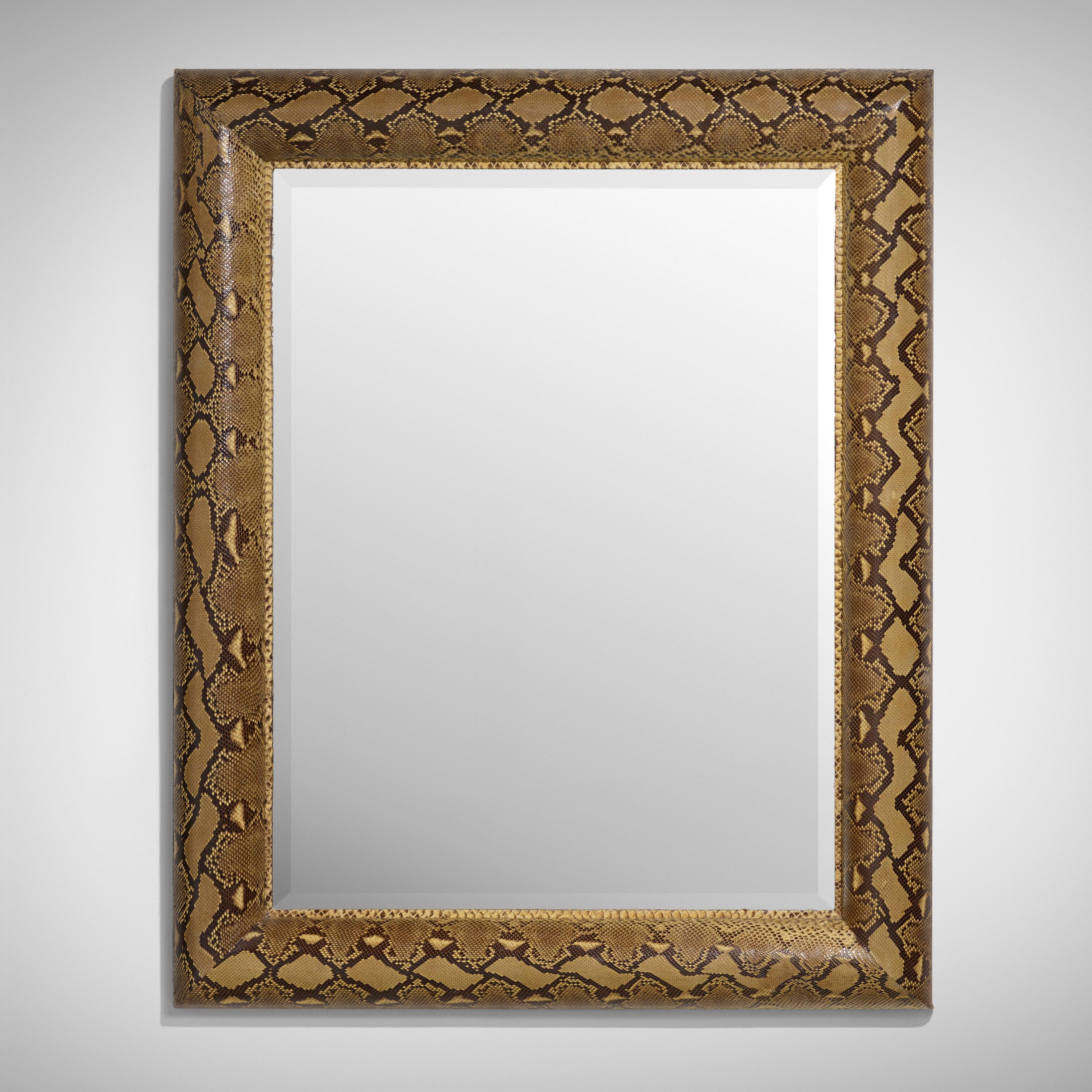 Important python skin covered rectangular mirror by Karl Springer , bearing painted brass manufacturer's label to reverse ‘Karl Springer’. With authentication from Tom Langevin, former director of Karl Springer, Ltd. USA: circa 1975 Mr. Springer's