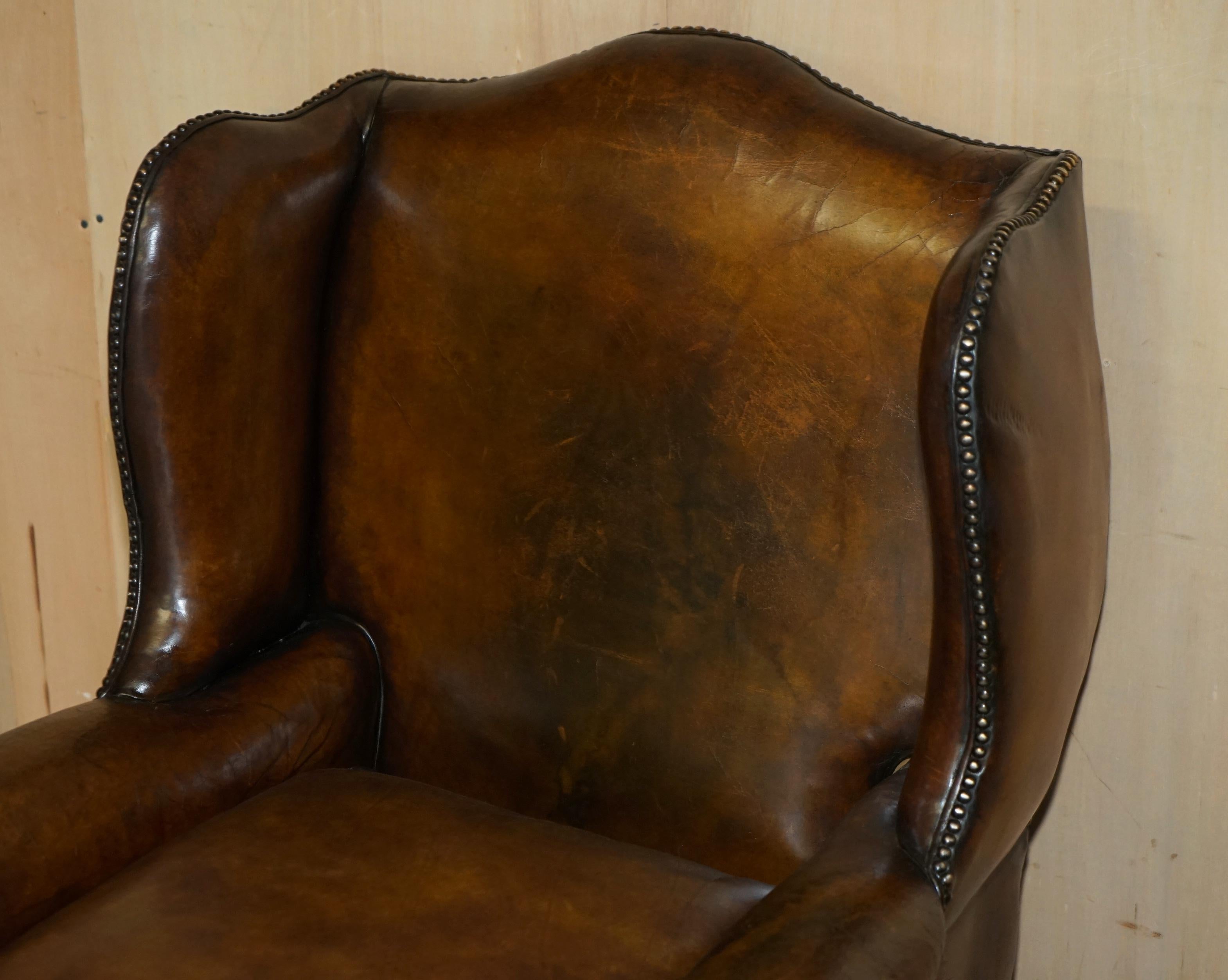 English IMPORTANT RESTORED GEORGE II PERIOD CIRCA 1760 WiNGBACK BROWN LEATHER ARMCHAIR For Sale