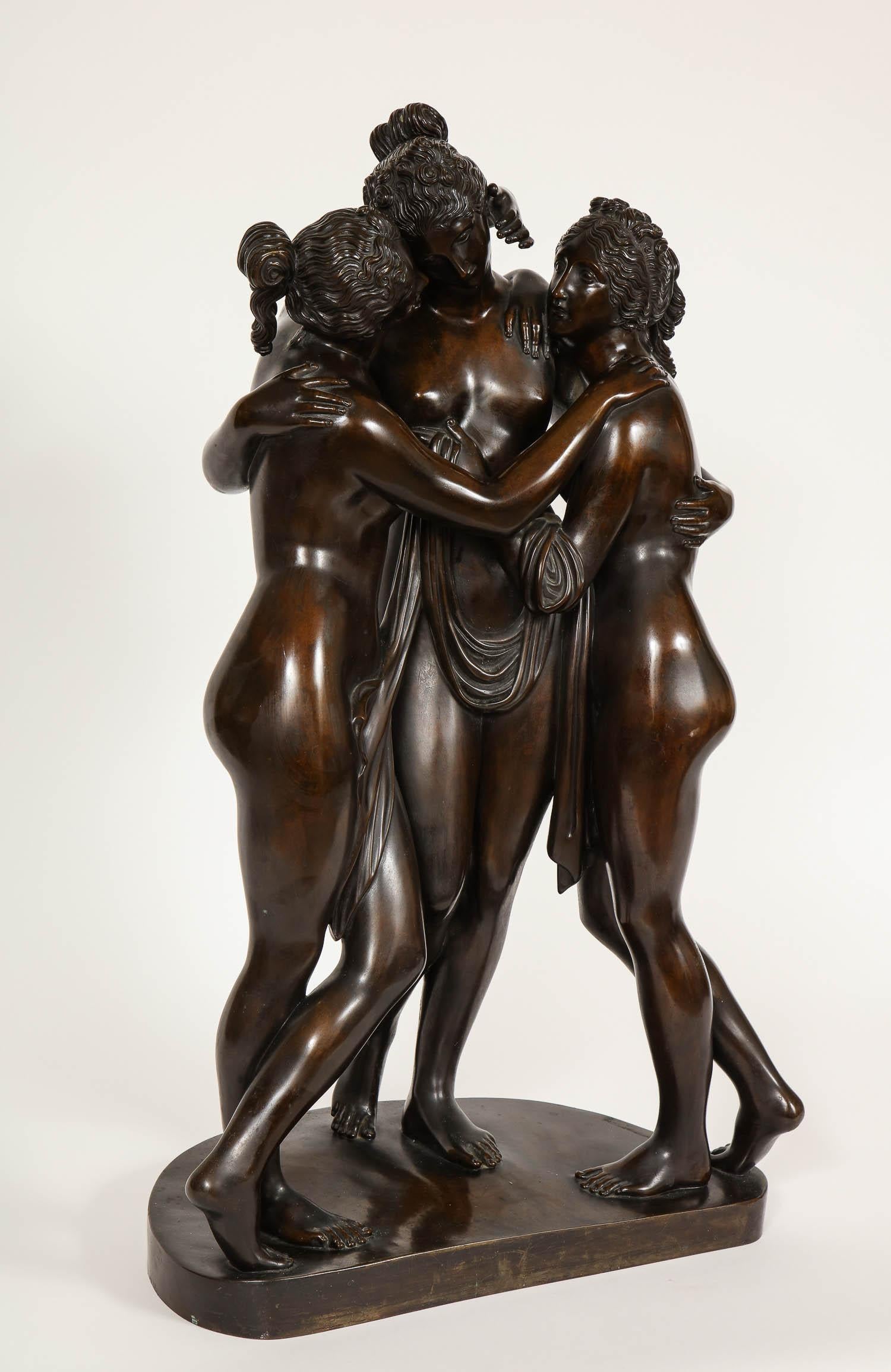 A very large and important bronze sculpture of the three graces, after Antonio Canova. This magnificent sculpture portrays the famous Three Graces by Canova in finely casted and hand-chiselled bronze with brown patina. They are a serene group that