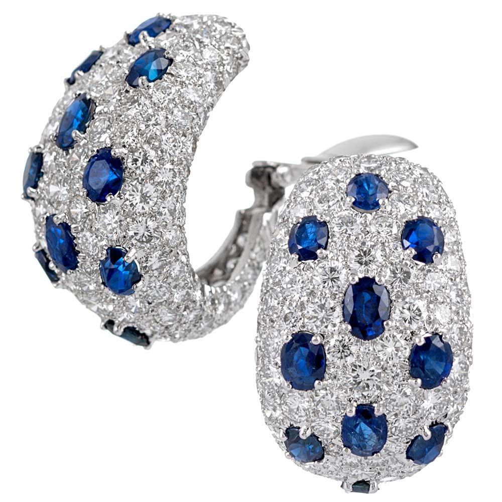 Striking hoop style earrings set with 8.48 carats of brilliant white diamonds and 6.40 carats of faceted oval sapphires, compliments of esteemed American design house David Webb. Although the media will satisfy the sophisticate, the