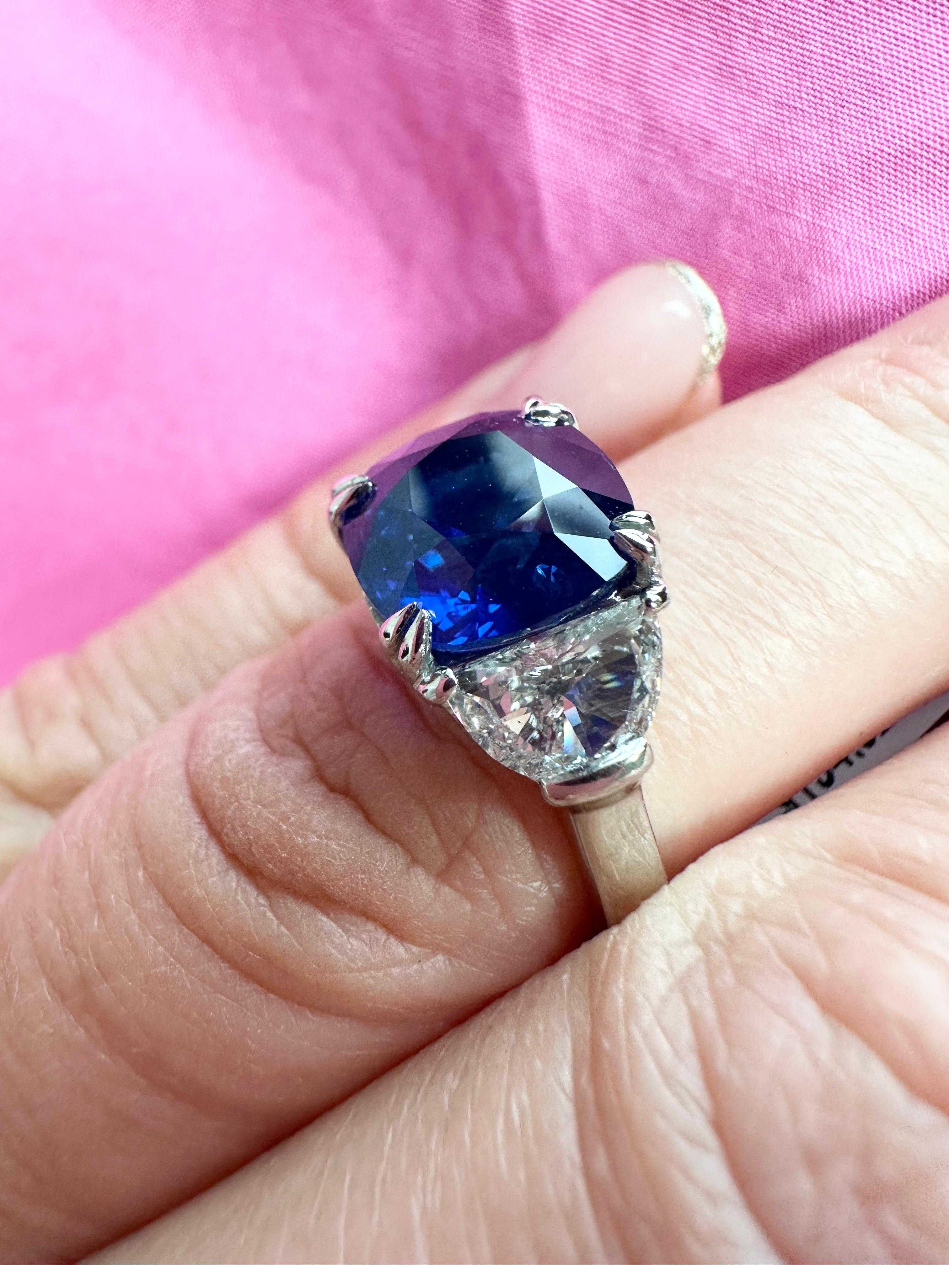 Rare Sapphire Diamond ring in platinum, made with two half moon diamonds with mesmorizing sapphire color center!

METAL: PLATINUM
NATURAL SAPPHIRE:
Carat:4.94ct
Cut: Cushion
Clarity: Slightly Included
Color: Blue

NATURAL DIAMOND(S):
Clarity/Color: