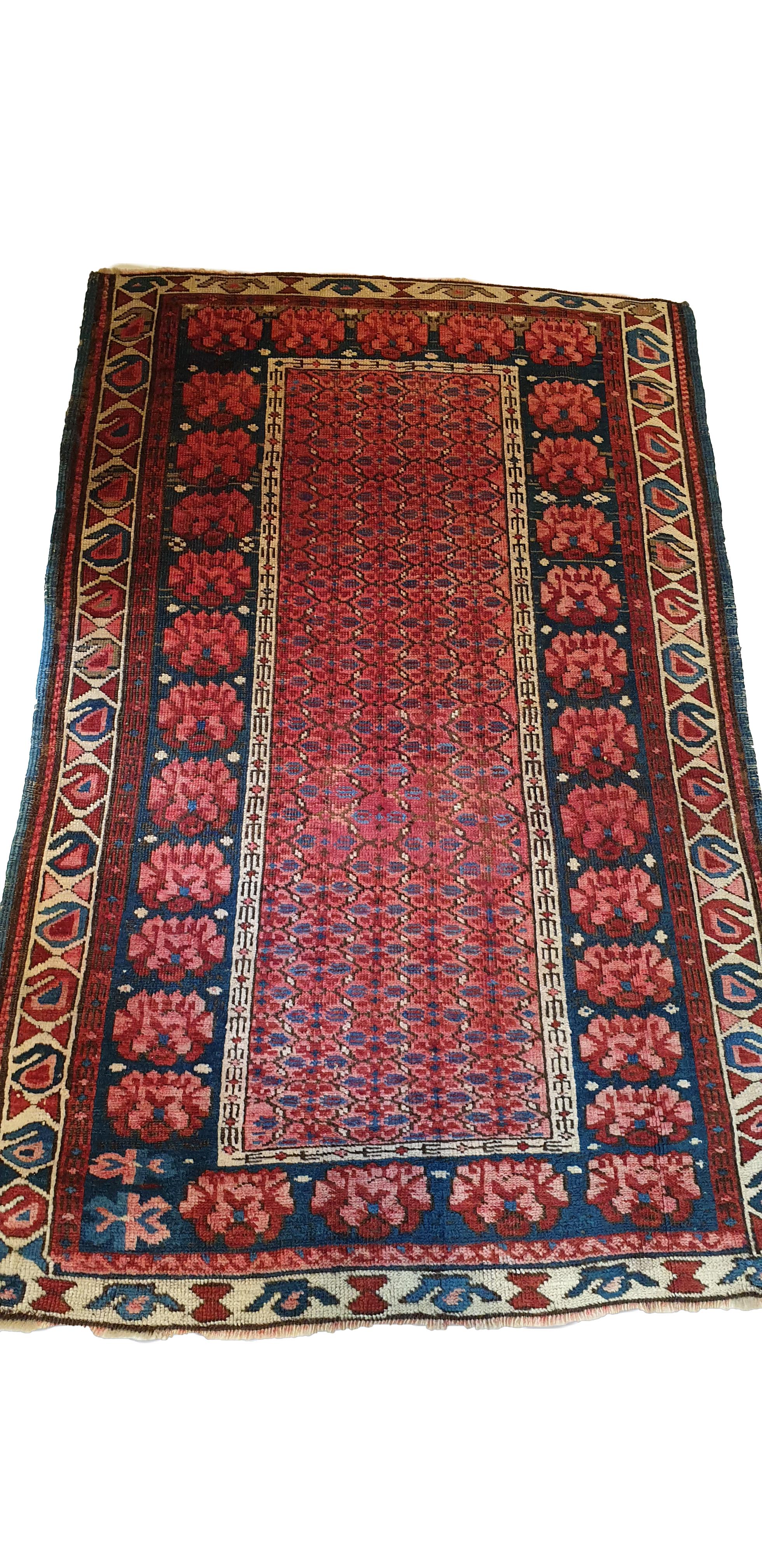 Hand knotted carpet in Russia at the beginning of the 19th century.
Representation of red flowers mainly in the rectangle in the center and the same, larger flowers form the outline.
High quality, beautiful graphics and remarkable finesse.
Perfect