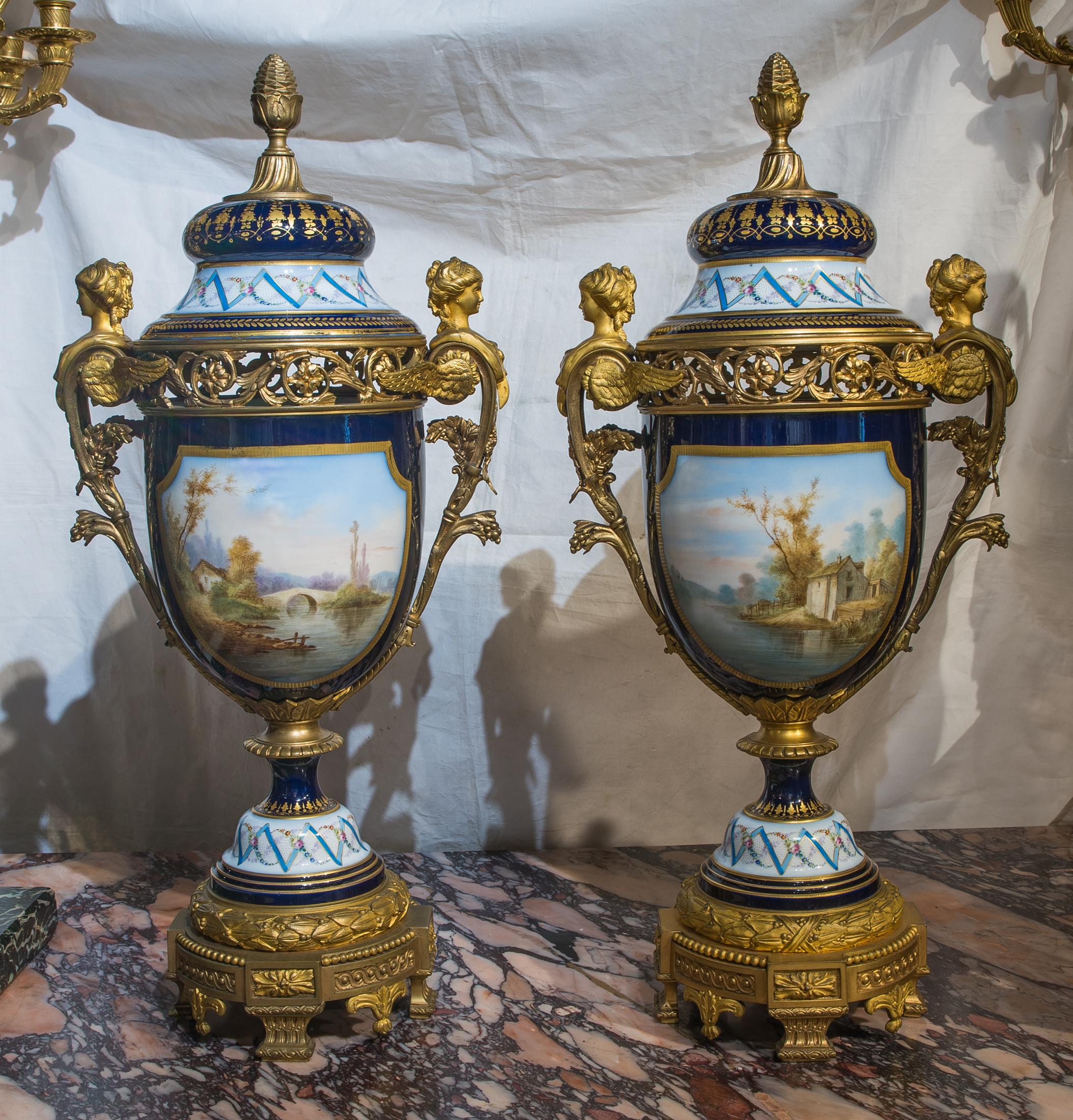 A fine and important Sèvres style bronze mounted and cobalt porcelain with hand painted courting figures in landscapes.

Origin: French
Date: 19th century
Dimension: 29 in. x 13 in.