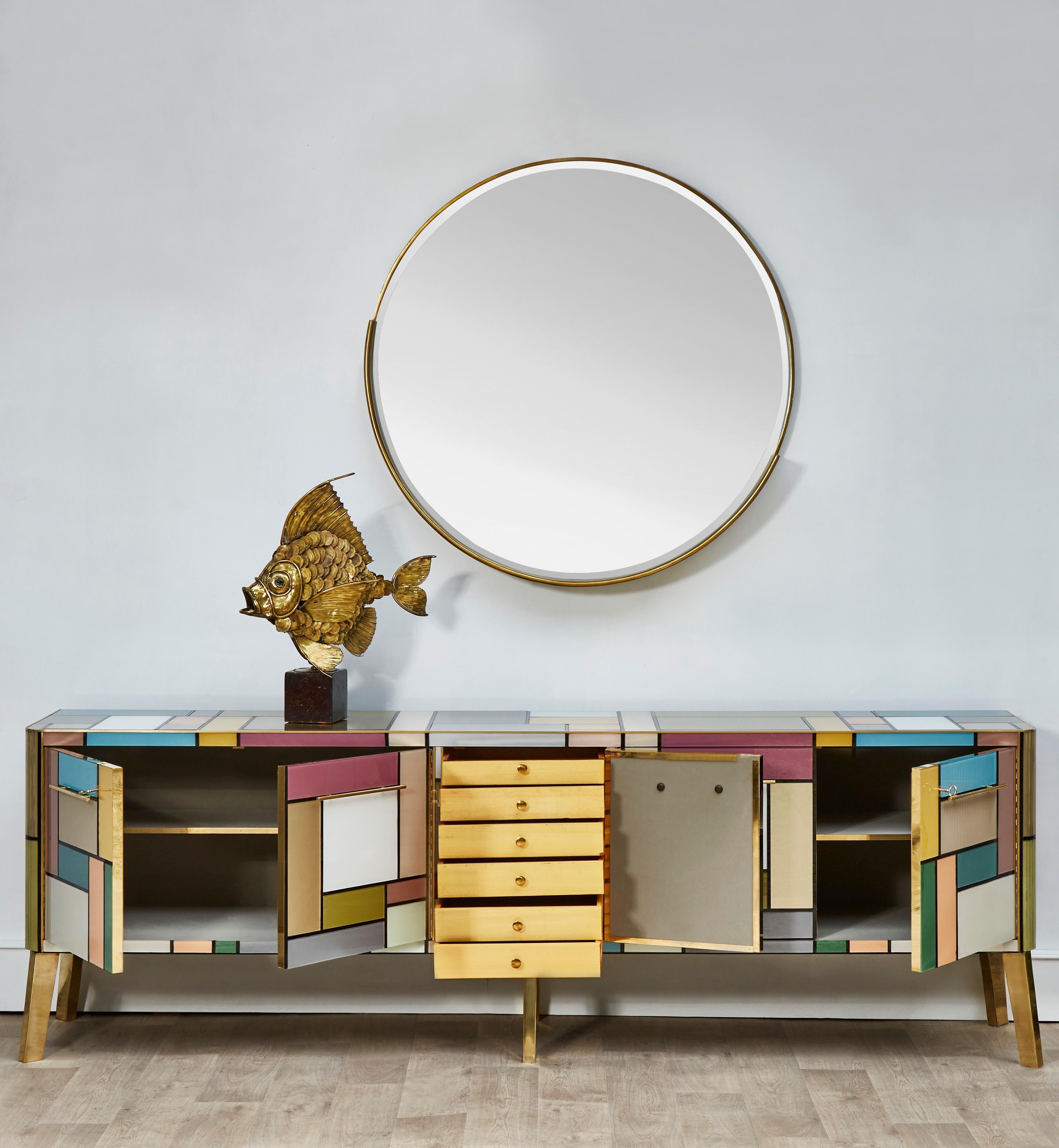 Incredible vintage long sideboard, entirely restored and customized with tainted mirrors and brass in the spirit of Mondrian.
Restoration by Studio Glustin.