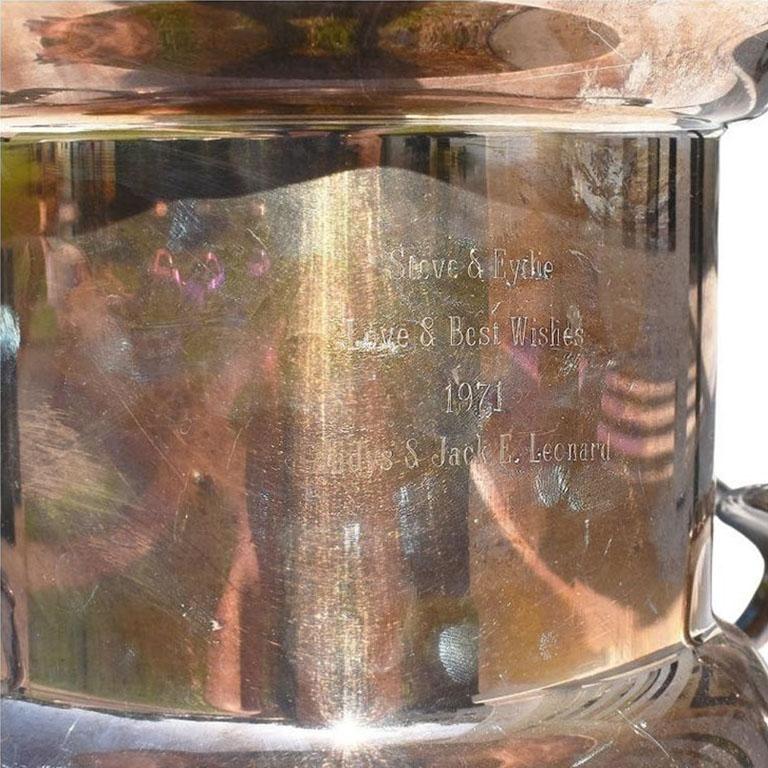 A large silverplate champagne bucket or ice bucket which was given to Steve Lawrence and Eydie Gorme by Gladys & Jack Leonard. Jack Leonard was a well-known actor and comedian in the mid-20th century. He performed on a variety of television variety