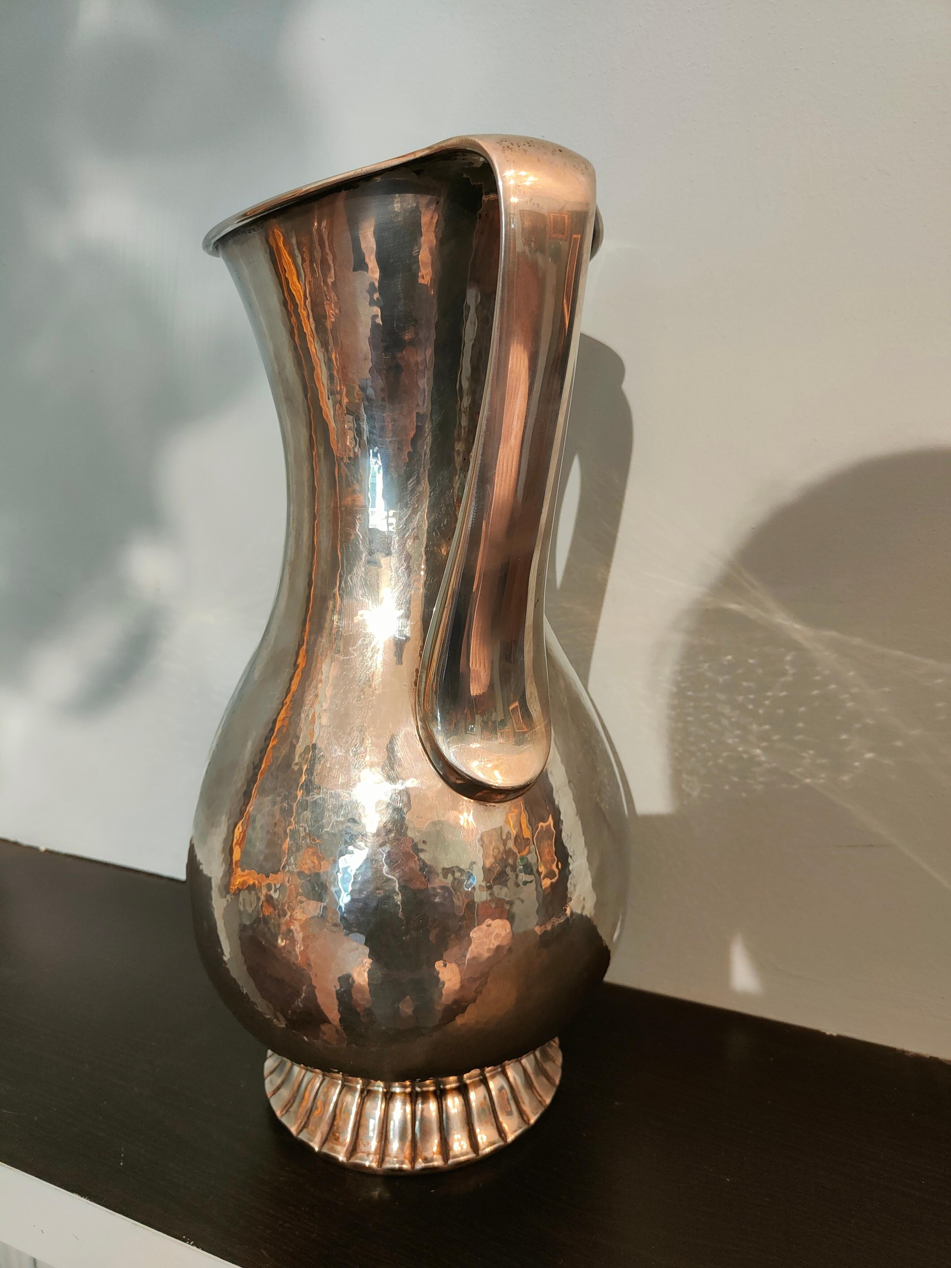Large silver vase from the 30s.
Maker / Silversmith: Luigi Genazzi Milan.
Hallmark: 23 MI.
The shape of the vase makes it a unique piece of 1930s design. 
Weight: 2395 gr.
Size: 44 X 25.5cm.
The value of some silver works, sometimes