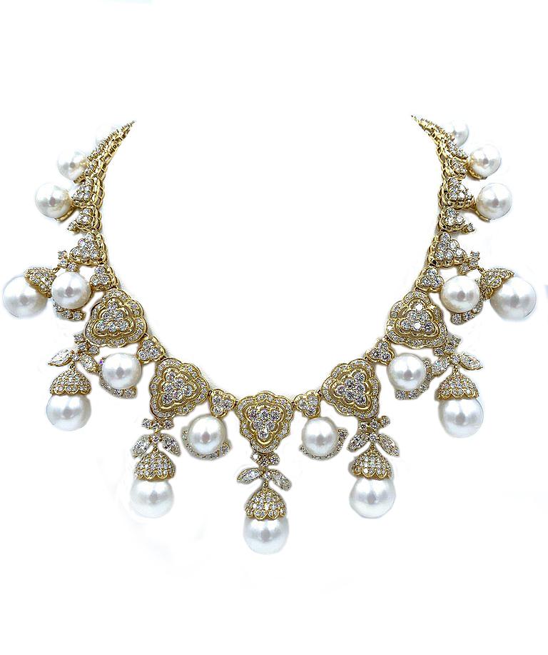 Regal and spectacular diamond and 18kt yellow gold South Sea pearl necklace. This necklace has amazing sparkle and life!
19 South Sea pearls - 12 to 15.5 mm
42 carats of fine diamonds 
Mounted in 18kt yellow gold 