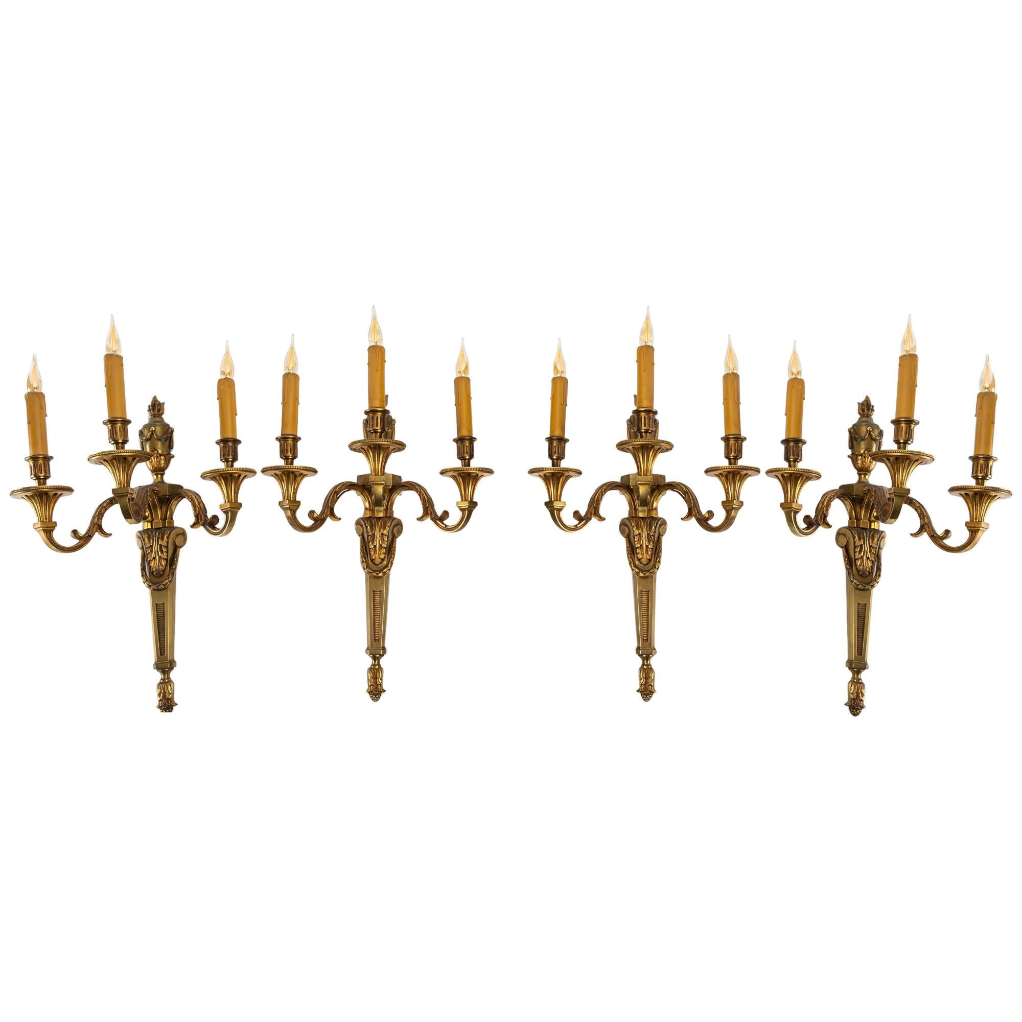 Important Suite of Four Bronze Sconces