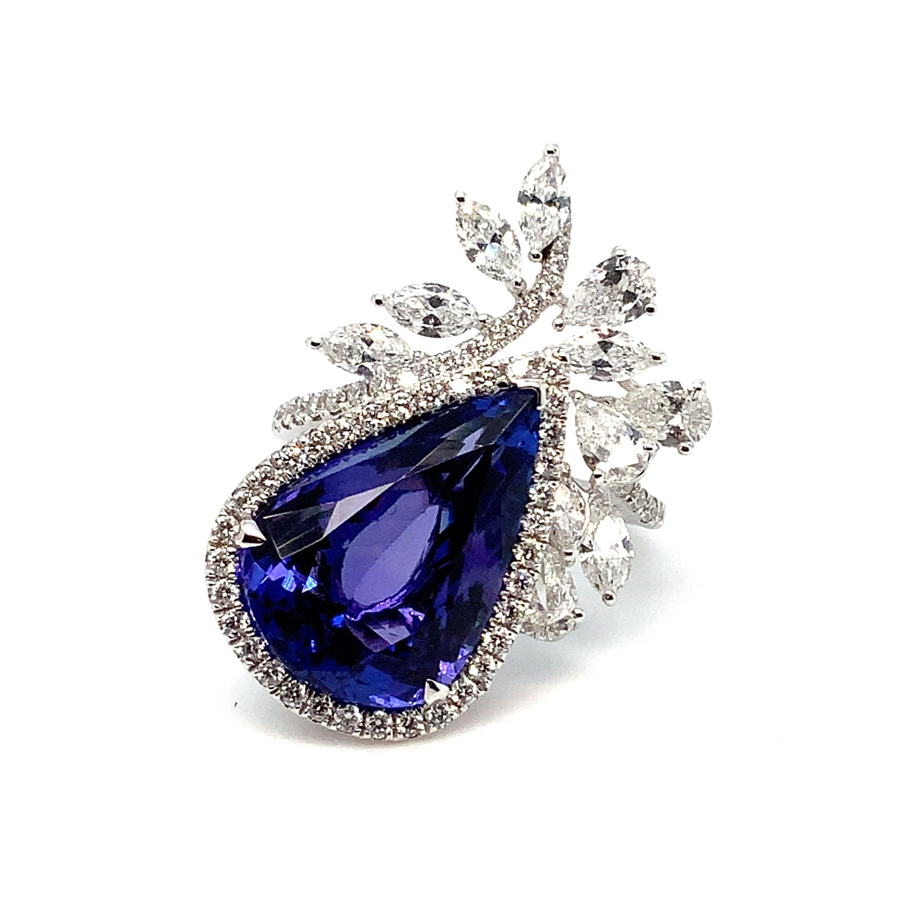 This exquisite Right Hand Ring boasts superior craftsmanship and breathtaking appeal. Its sleek 18K White Gold setting highlights the unparalleled design of the piece. The ring features an impressive 9.29 carats of Pear Shaped Gem Quality Tanzanite,