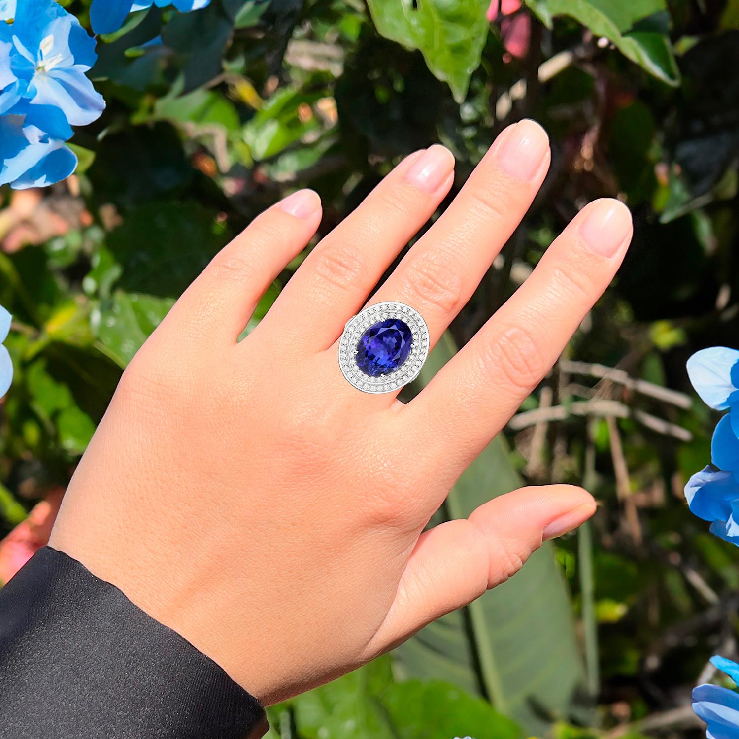 It comes with the Gemological Appraisal by GIA GG/AJP
All Gemstones are Natural
Tanzanite = 12.51 Carats
Cut: Oval
98 Round Diamonds =  1.25 Carats
Metal: 18K White Gold
Ring Size: 8 US
*It can be resized complimentary
