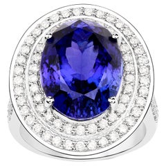 Importante anillo de tanzanita con halo de diamantes 13,7 quilates total Oro de 18 quilates