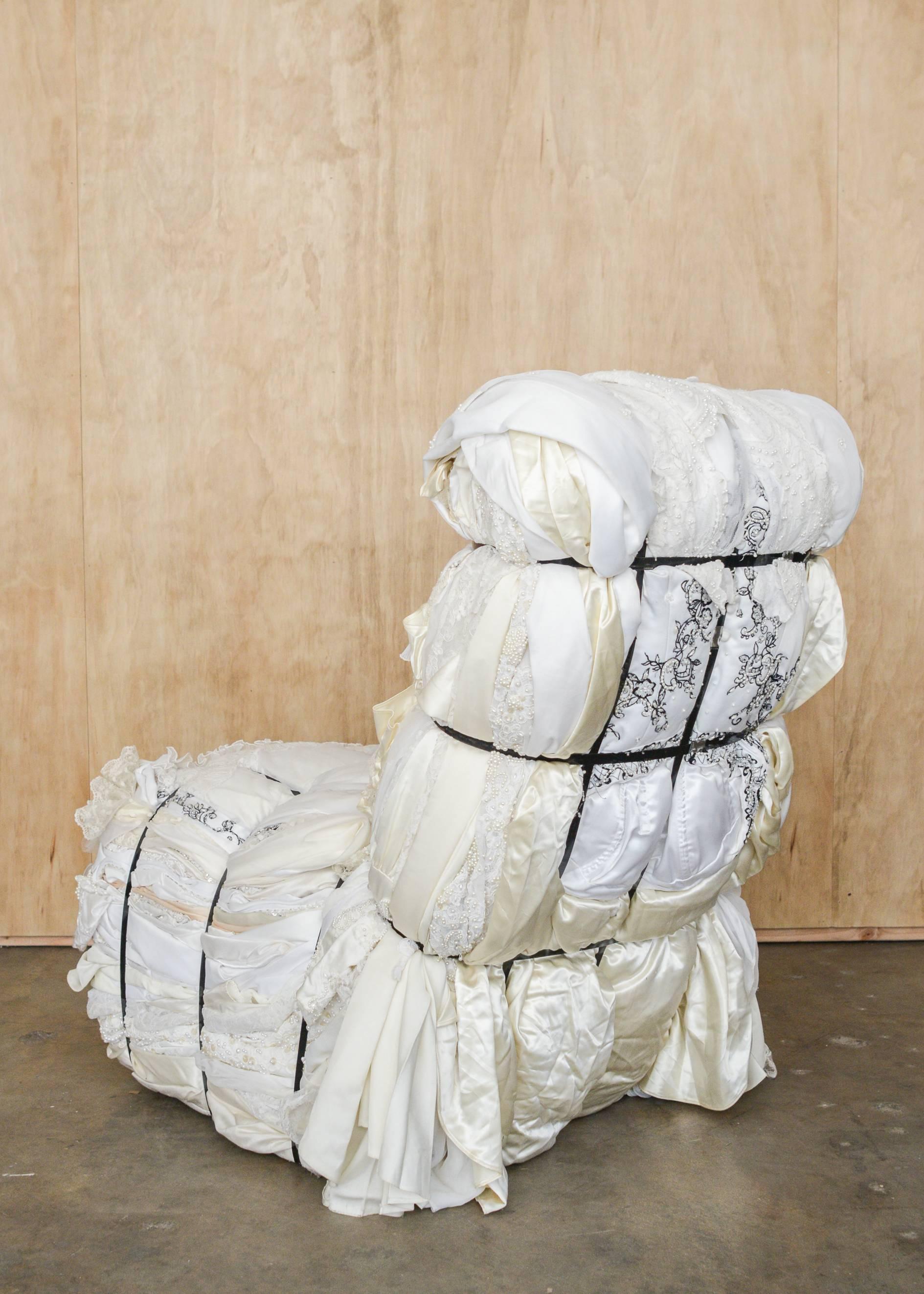 An important custom ordered Tejo Remy (Dutch b. 1960) rag chair for Droog design. One of a kind and individually handcrafted from 100+ pounds of customer supplied wedding dresses bound with steel straps.