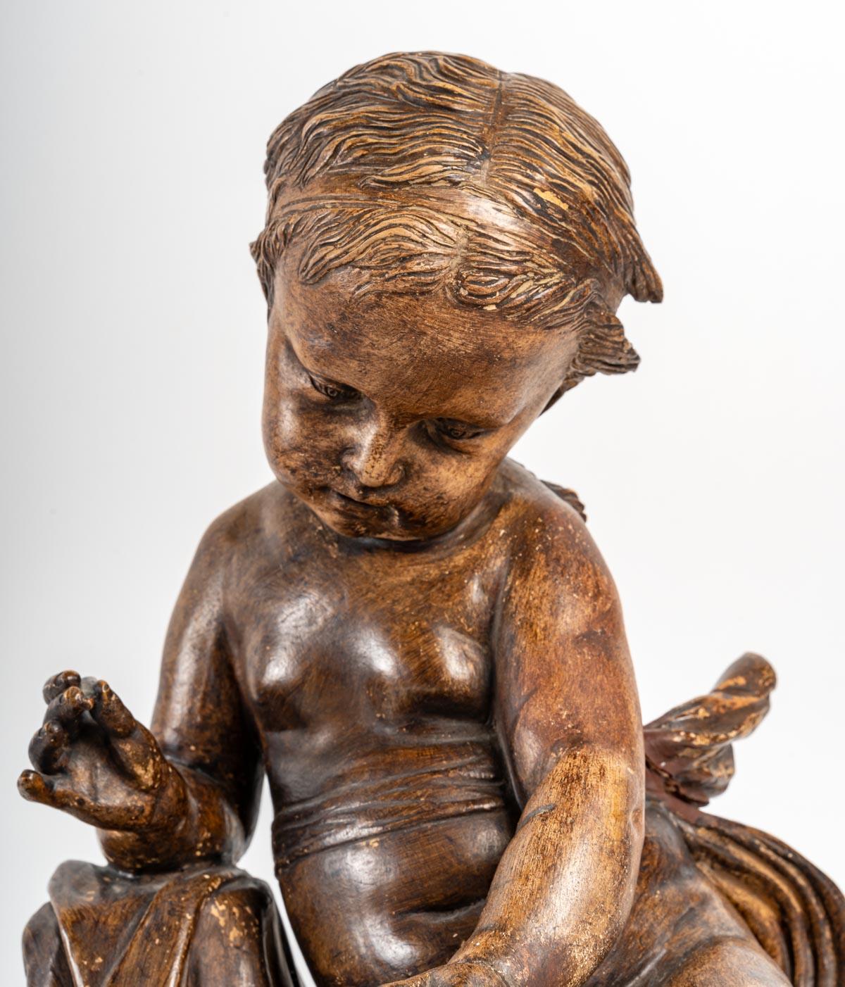 Importante statuette en terre cuite représentant un bébé en vente 2