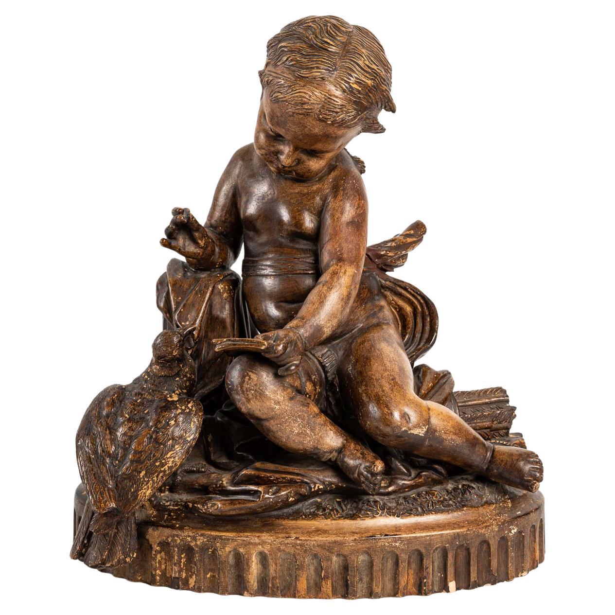 Importante statuette en terre cuite représentant un bébé
