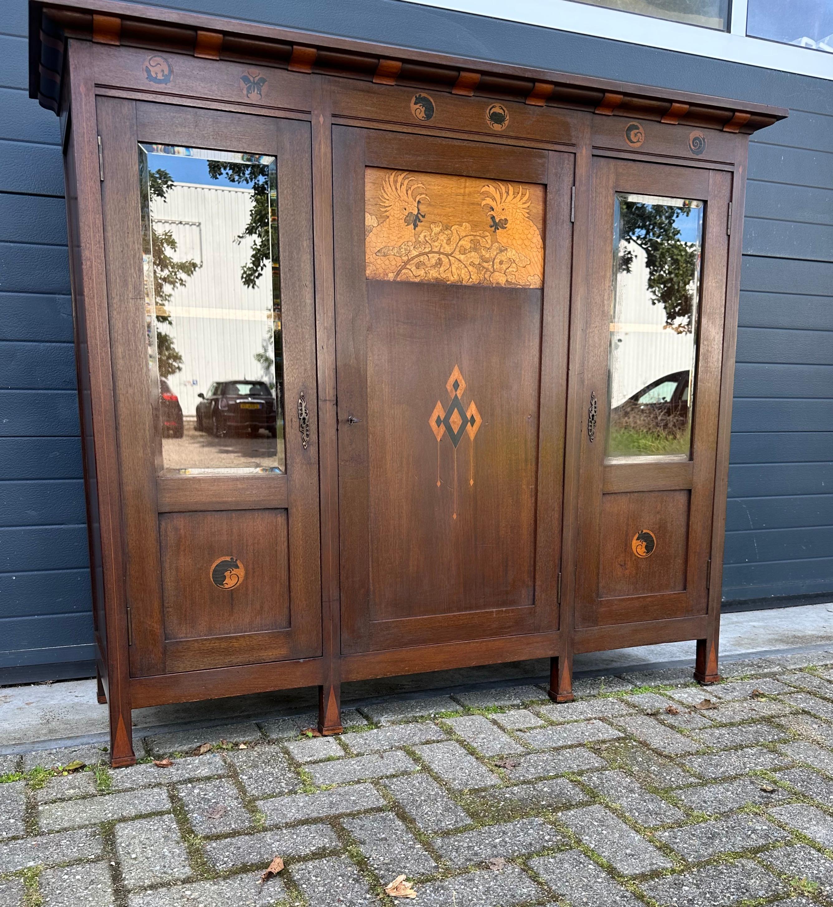 Top design and top quality workmanship from Amsterdam from the early 1900's.

One of a kind bookcase or side cabinet from 't Modelhuis by Jewish furniture maker Napoleon le Grand. Work from this Amsterdam based, Jewish furniture maker from the