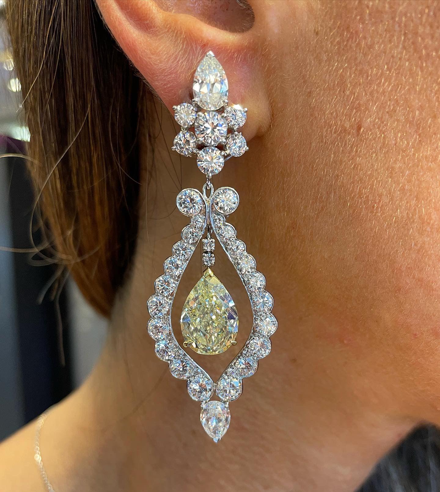 Van Cleef and Arpels Fancy Yellow Diamond Earrings
Fancy Yellow Pear Modified Brilliant-cut Colored Diamonds one 7.02 and the other 7.01 carats, Surrounded by Pear-shape and circular-cut Diamonds
Signed Van Cleef & Arpels and numbered
The earrings