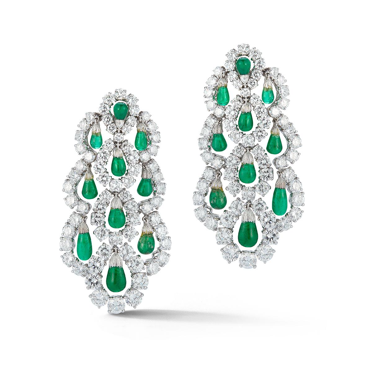 Van Cleef & Arpels Dangling Emerald & Diamond Earrings
Large size: Measurements :2 1/8 inches by 1 1/8 inches 
Superbly made: the emeralds dangle/dance within the diamond frame- amazing craftmanship to see in person.
App Diamond weight: 11.00 cts.