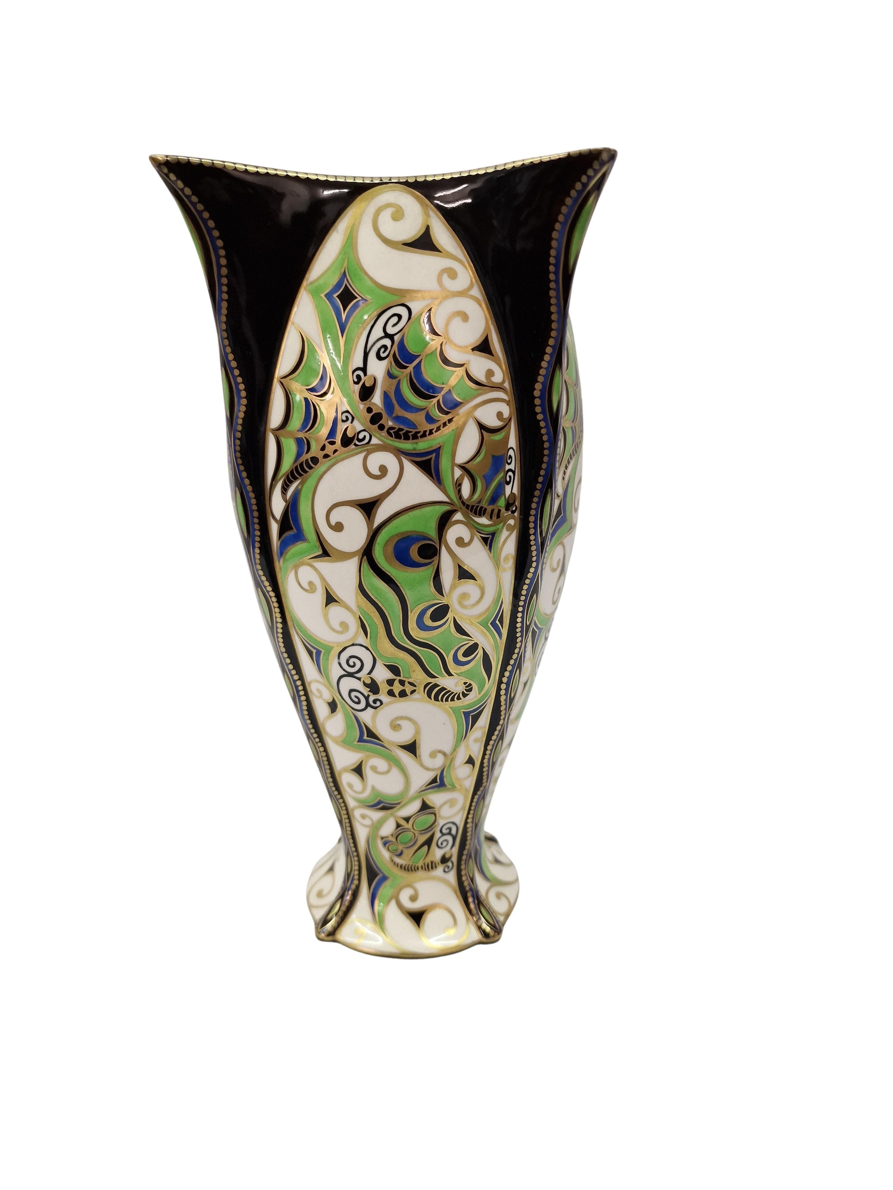 A very rare and important vase crafted in Austria. The vase is the work of Karl Klaus (1889-1925) and was crafted by the maker Ernst Wahliss around 1911. 

The vase has a round base, the body tapers and then curves upwards and ends in four outwardly
