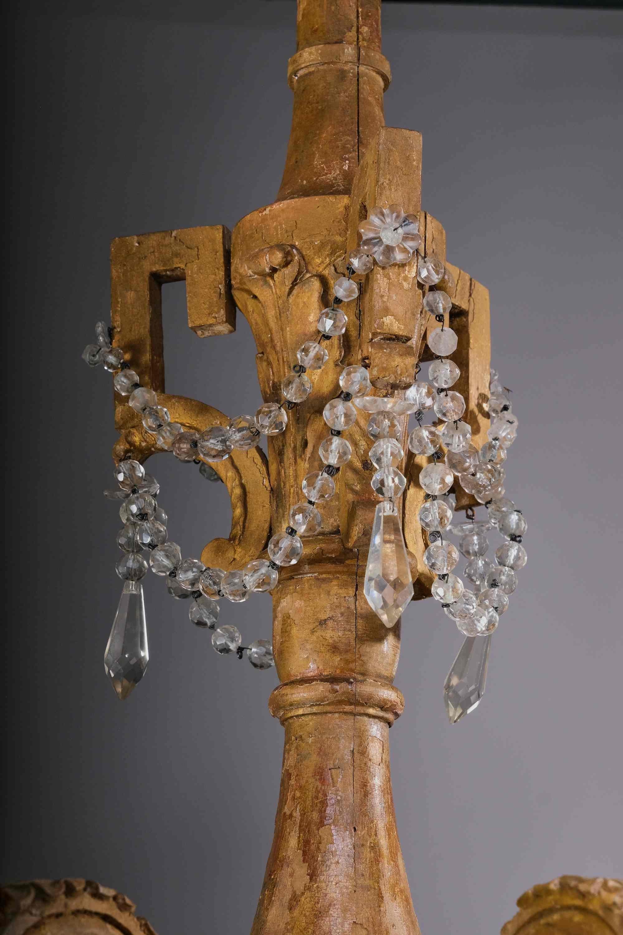 Carved Important woodcarved and gilted Louis XVI chandelier, Italy, late 18th century For Sale