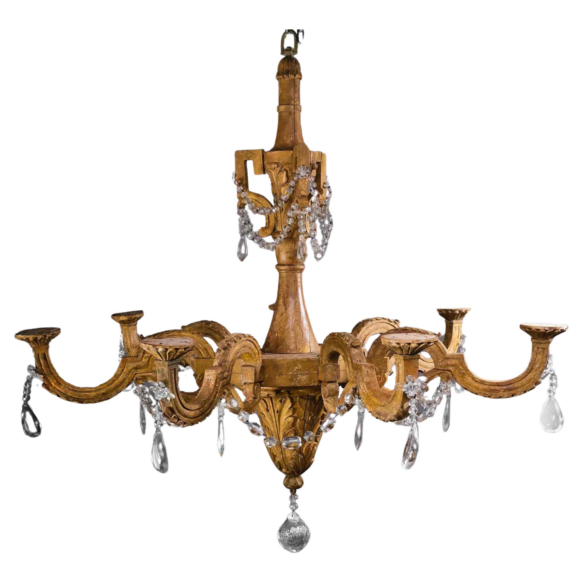 Important woodcarved and gilted Louis XVI chandelier, Italy, late 18th century For Sale