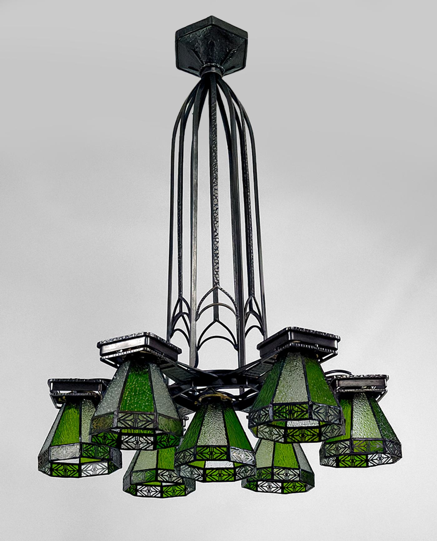Important wrought iron chandelier.
Art Deco / Gothic.
France, Circa 1920
7 lights
Tulips / stained glass shades.

Restored, new electricity, in perfect condition.

Dimensions:
height 94 cm
diameter 66 cm

Weight: approximately 30 kg