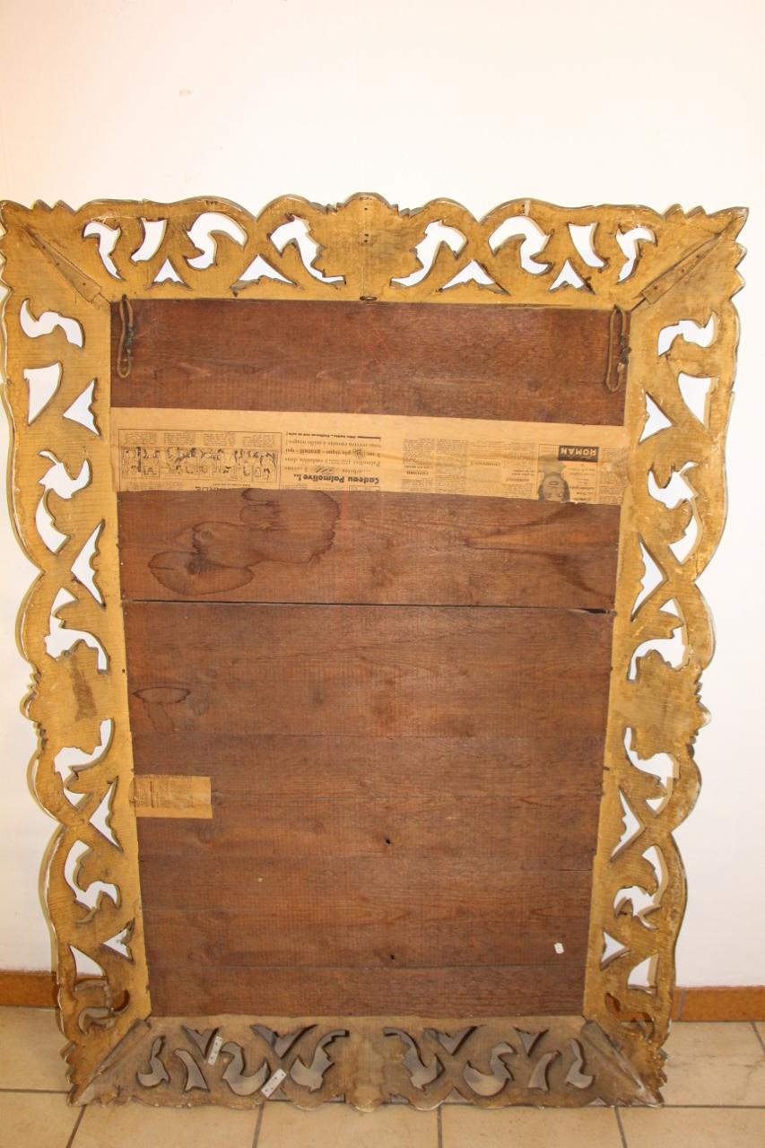 Important mirror has a framing gilded wood decor openwork foliage and shells Italy 19th century gilding in good condition, also mirror, large molding very decorative.