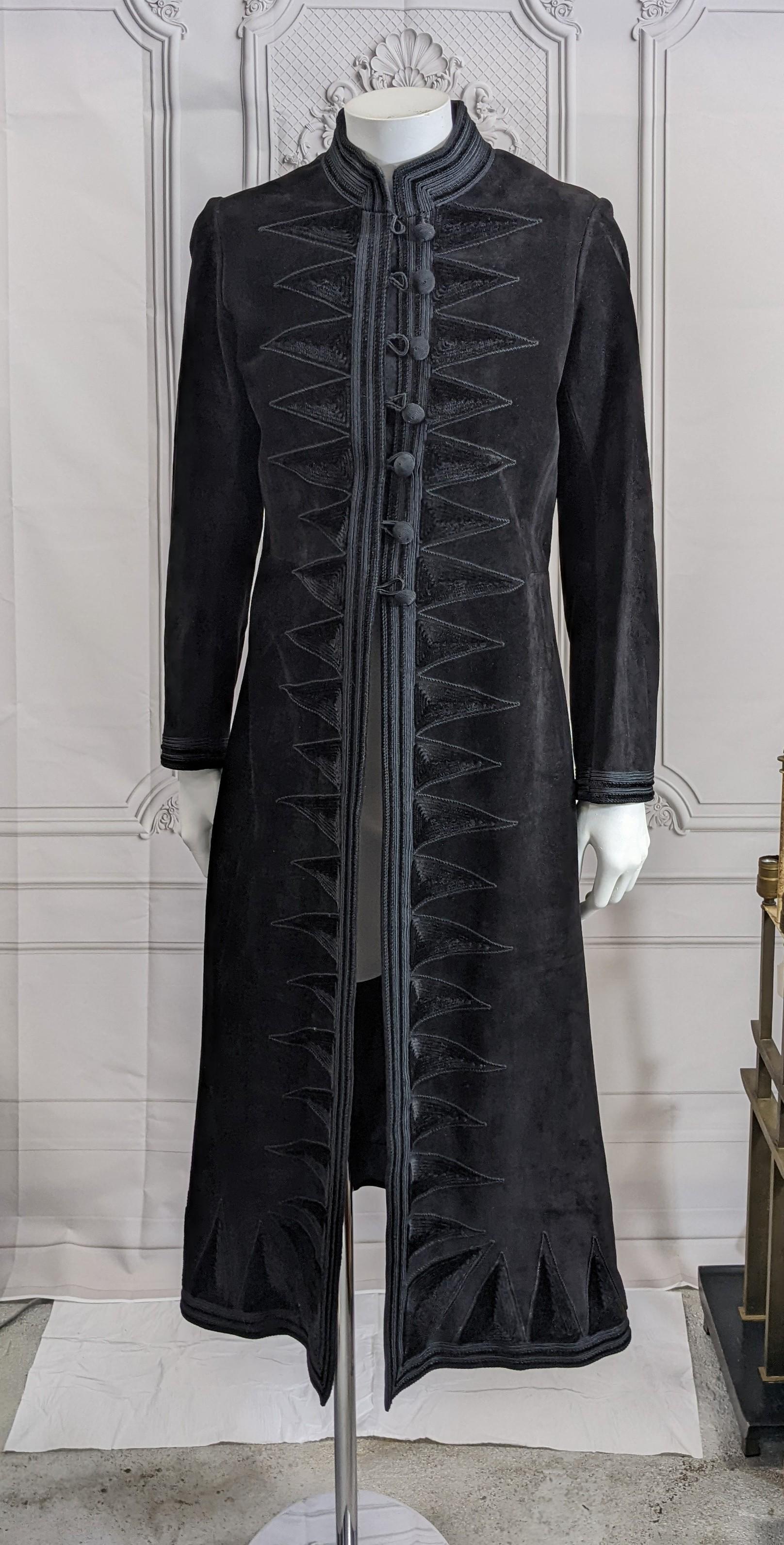 Extraordinary Museum Quality Yves Saint Laurent  Early Haute Couture coat from fall/winter 1970 in a Russian style which predates his Opera Ballets Russes collection by half a decade. The cossack styled long coat of black heavy suede embroidered in