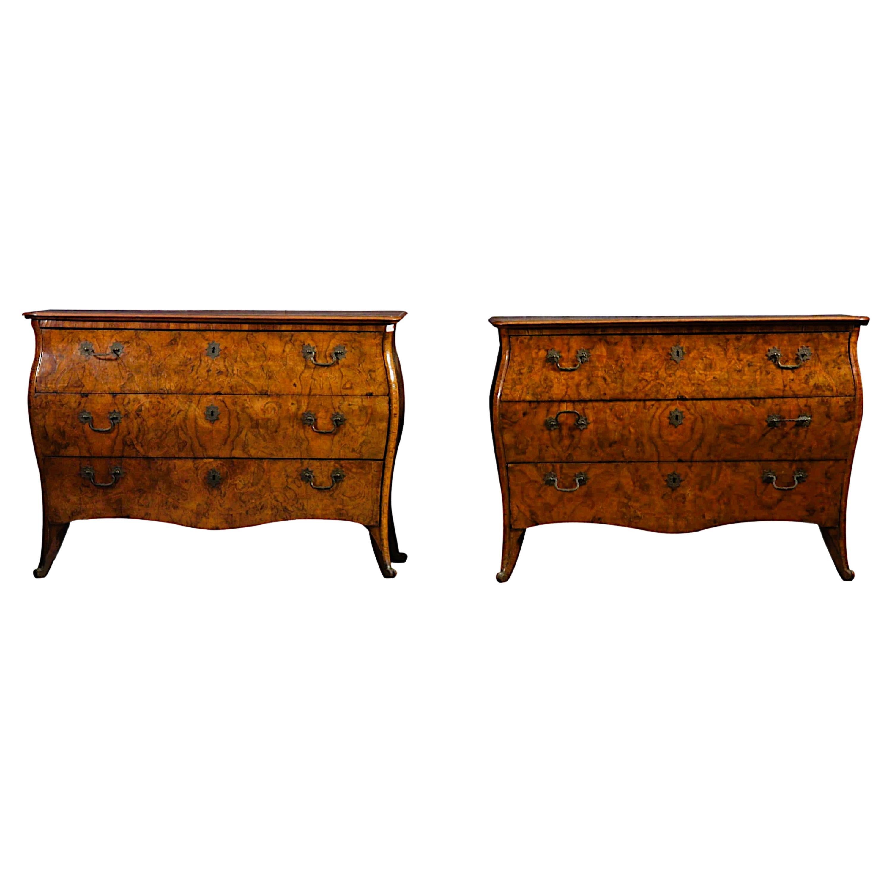 Important pair of Louis XV-era bowed and walnut-root dressers
