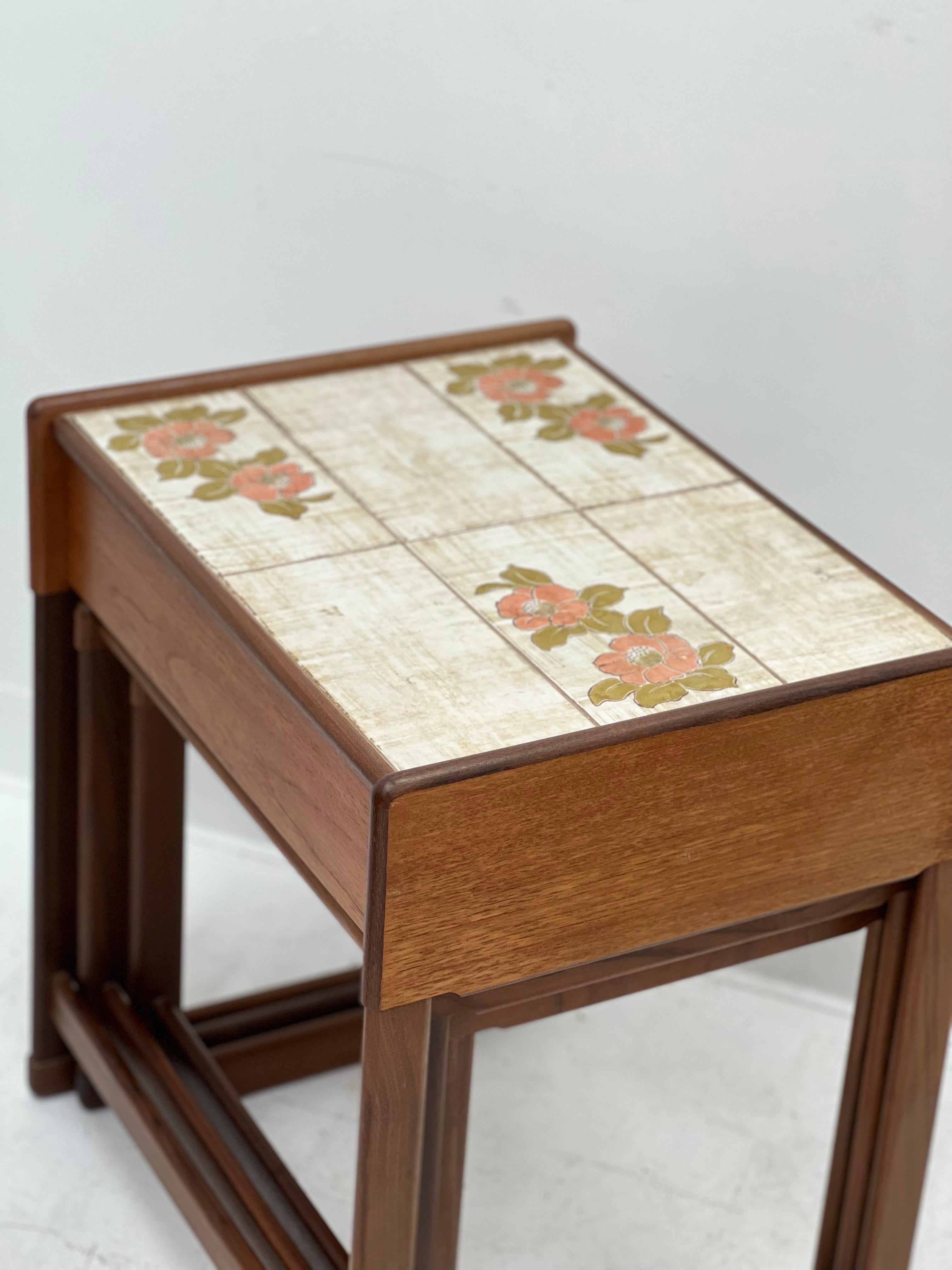 Imported solid wood teak Danish modern tile top nesting table. In great vintage condition.