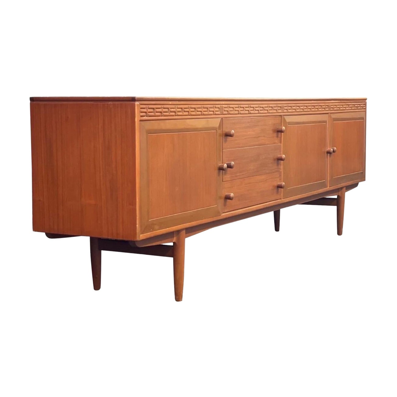 Imported UK Vintage Mid-Century Modern long credenza/buffet in the style of Robert Heritage for Archie Shine Furniture. 

Dimensions. 90 W ; 17 D ; 29 H.