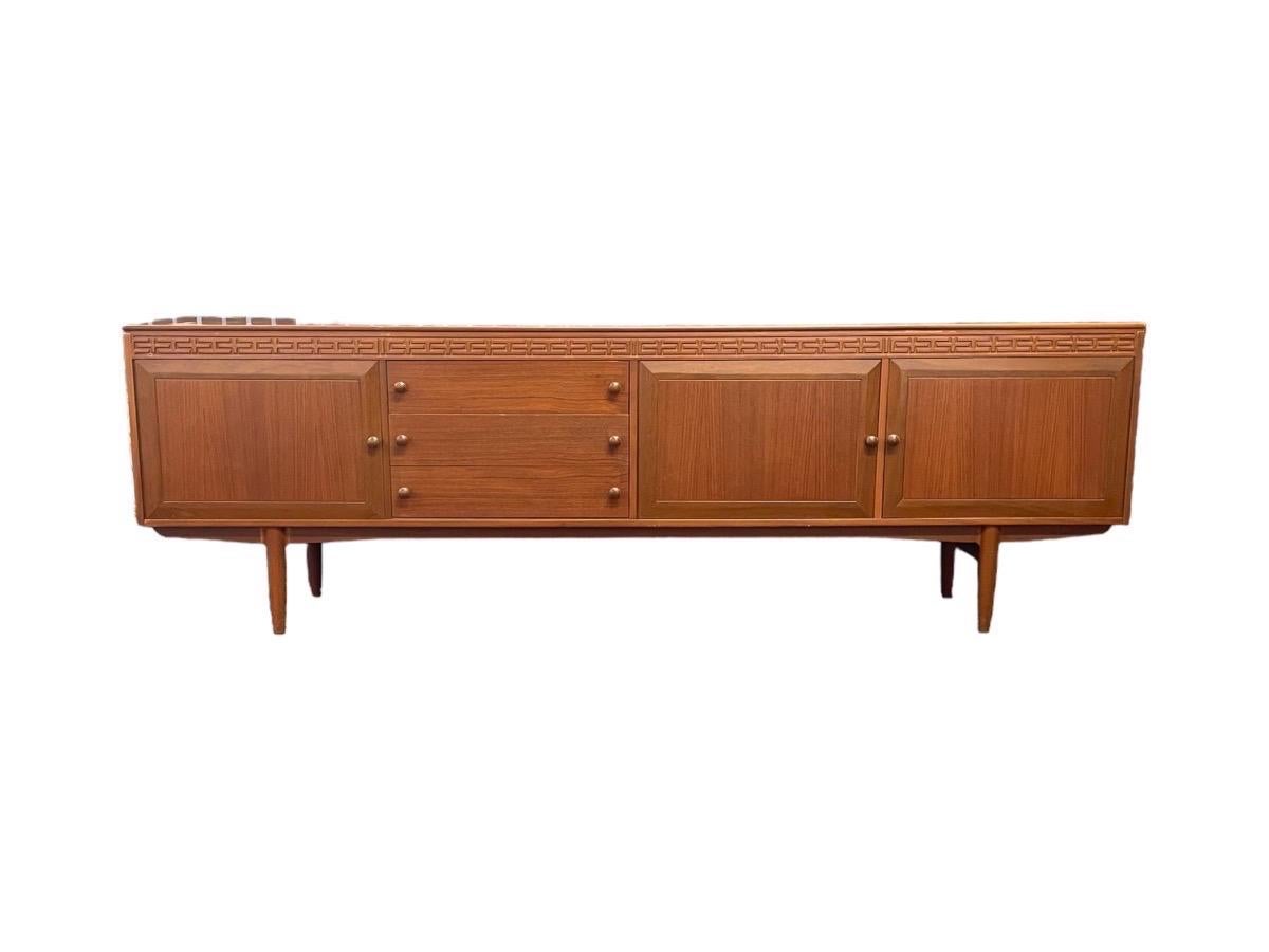 Imported UK Vintage Mid-Century Modern long credenza/buffet in the style of Robert Heritage for Archie Shine Furniture. 

Dimensions. 90 W ; 17 D ; 29 H.