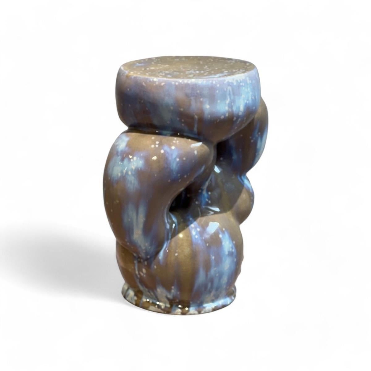Impose* (2024) by Rutger de Regt reimagines the stool as both functional object and sculptural statement. Crafted in ceramic with a vibrant blue glaze, its biomorphic form embodies De Regt’s process-oriented approach, blending abstraction and