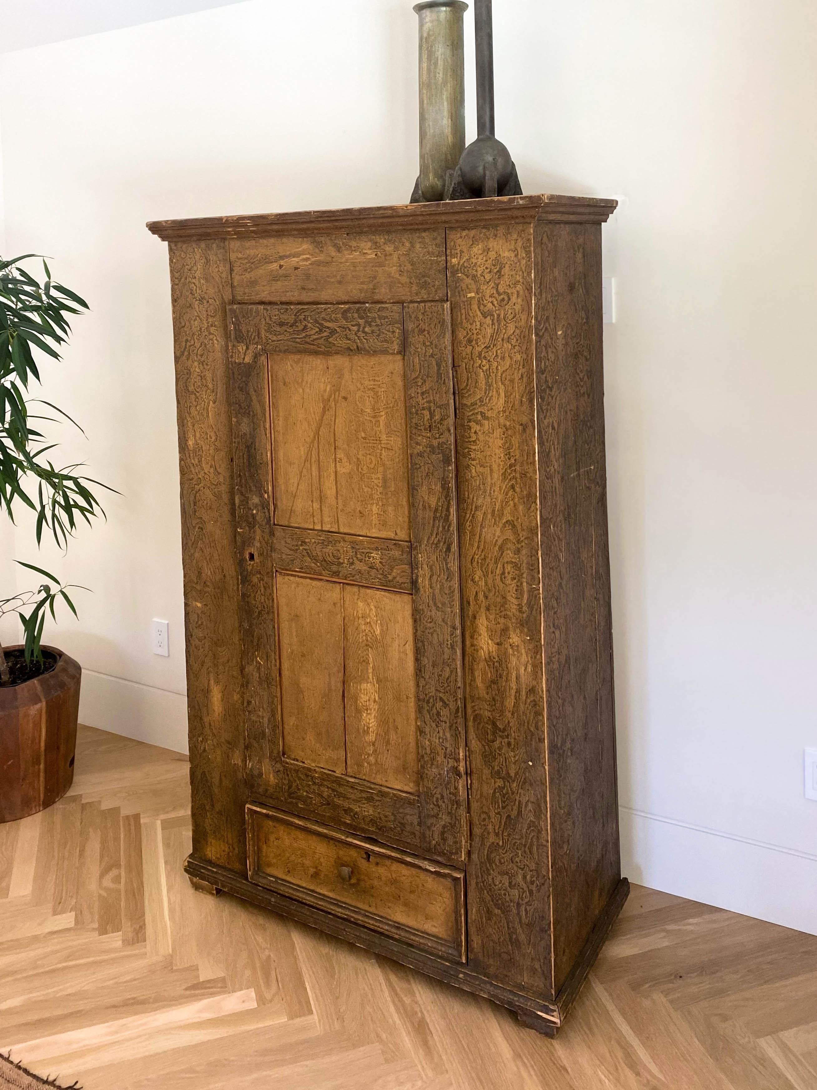 Rustic 19th century armoire cabinet in aged oak with new shelves.