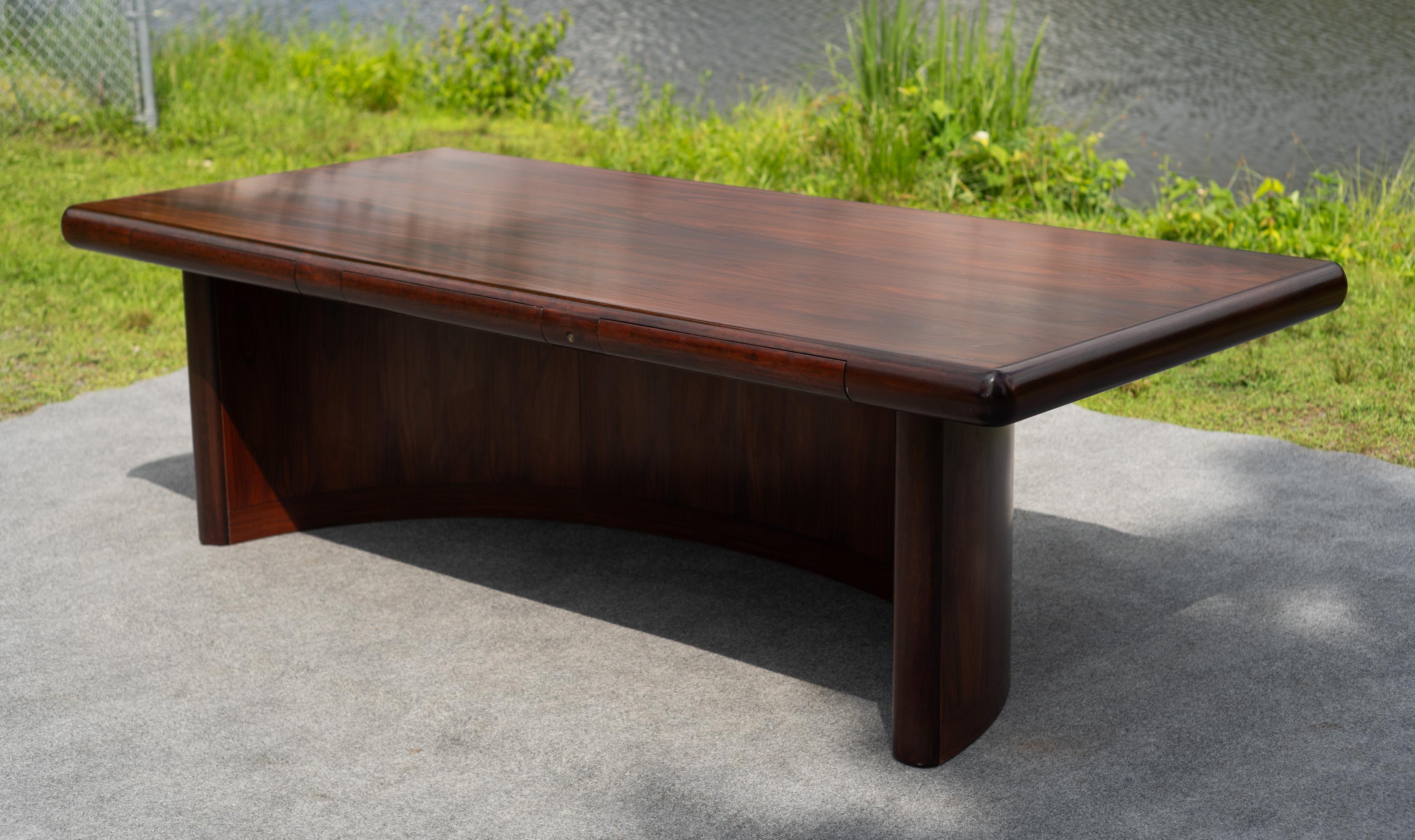 Designed and made in Copenhagen, Denmark by Dyrlund in the 1970s, this desk was once the crown jewel in Dyrlund's lineup. According to their website, this desk consists of models 8101B-1/8102, meaning the desk and its pedestal. Made of rosewood