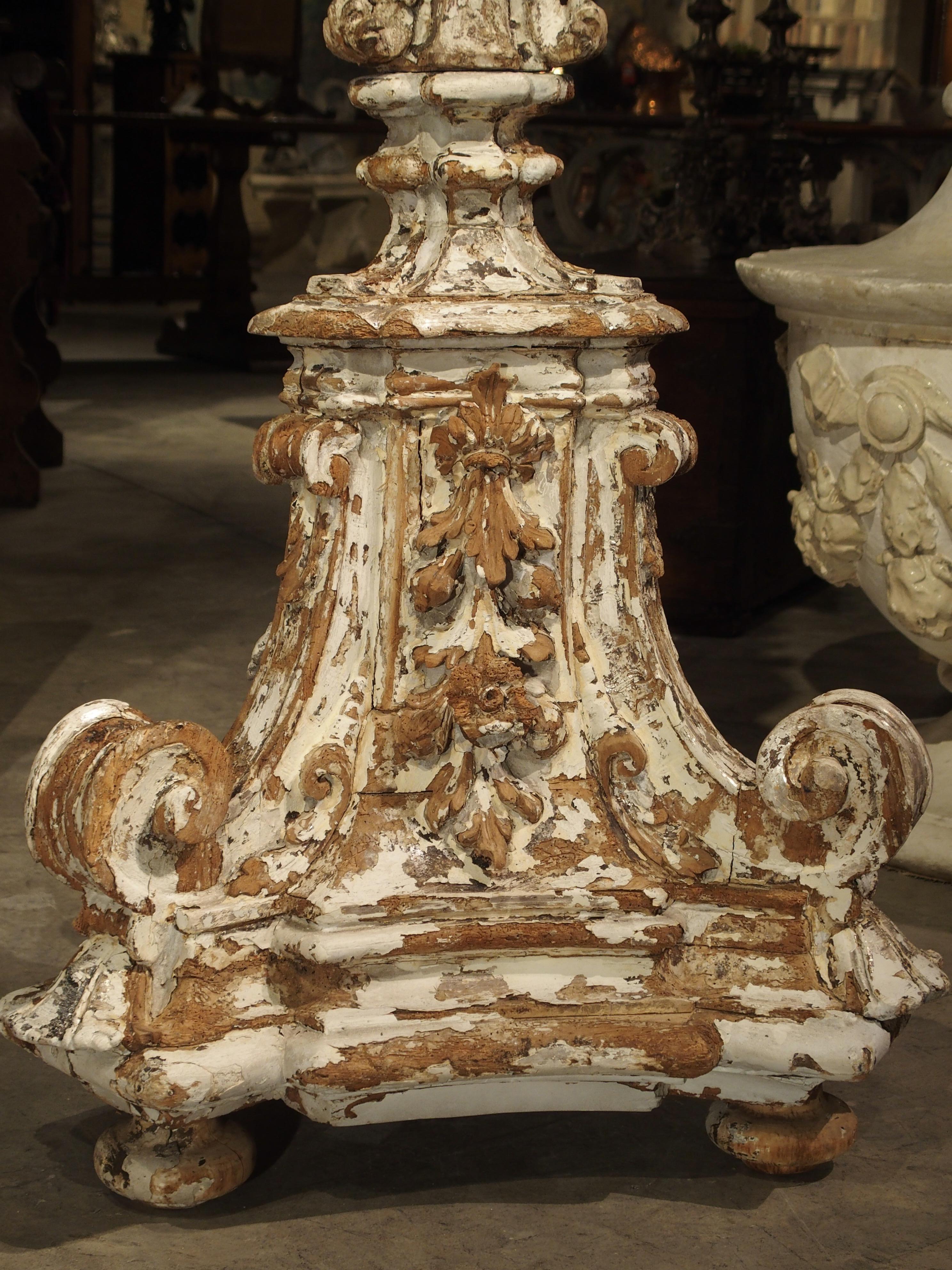 This parcel paint wooden floor torcheres from Italy date to the 1600s and they stand 7 feet tall. In person, they are very impressive and you immediately sense these were placed in a large and important space in their history. They have chips,
