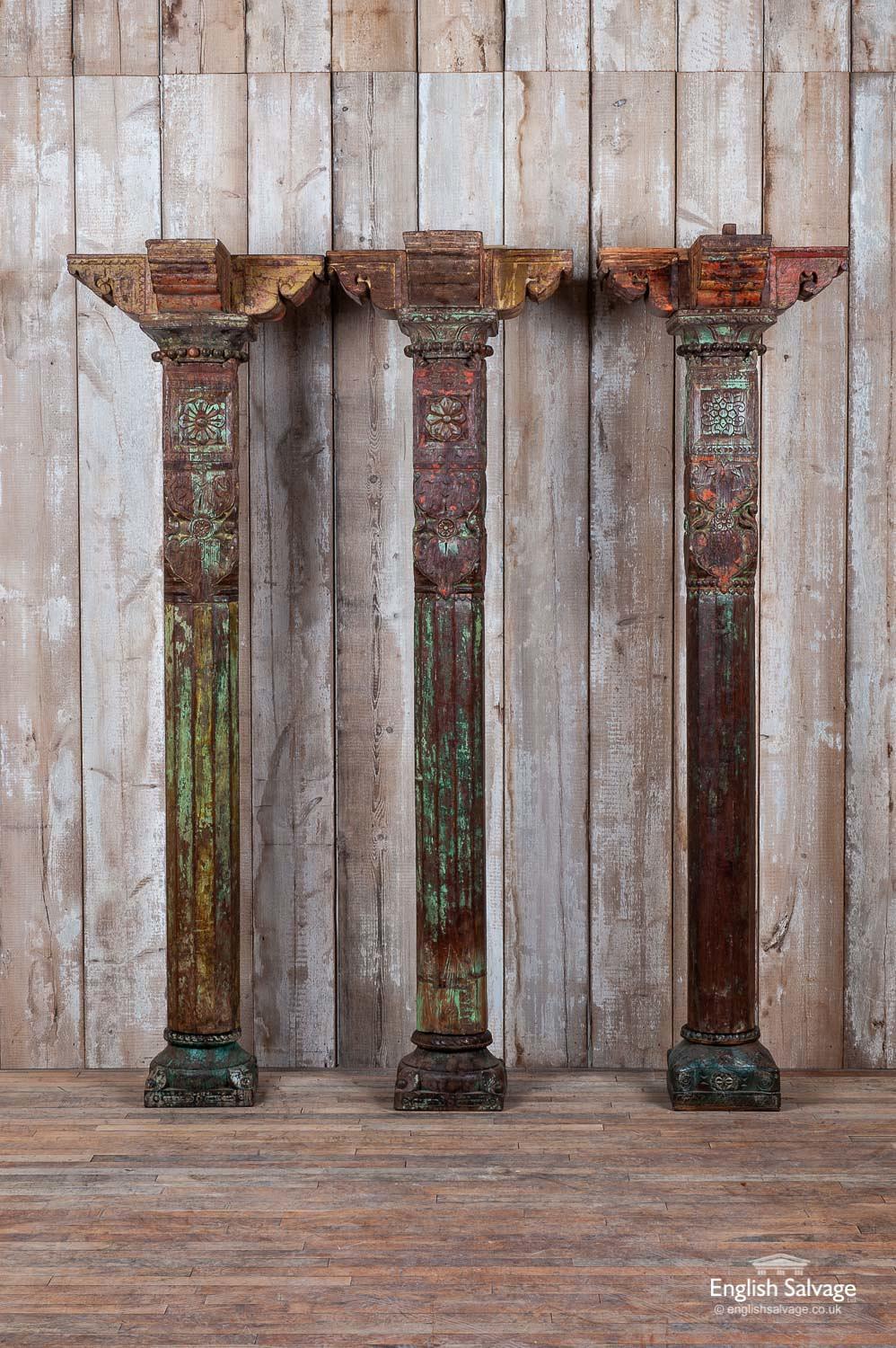 Impressive reclaimed antique hardwood pillars from Gujurat in India. Each pillar comes in three parts: a base, a column and a capital, all of which vary slightly in dimensions but all except A are 173-174cm high [A is 188cm high]. The bases vary in