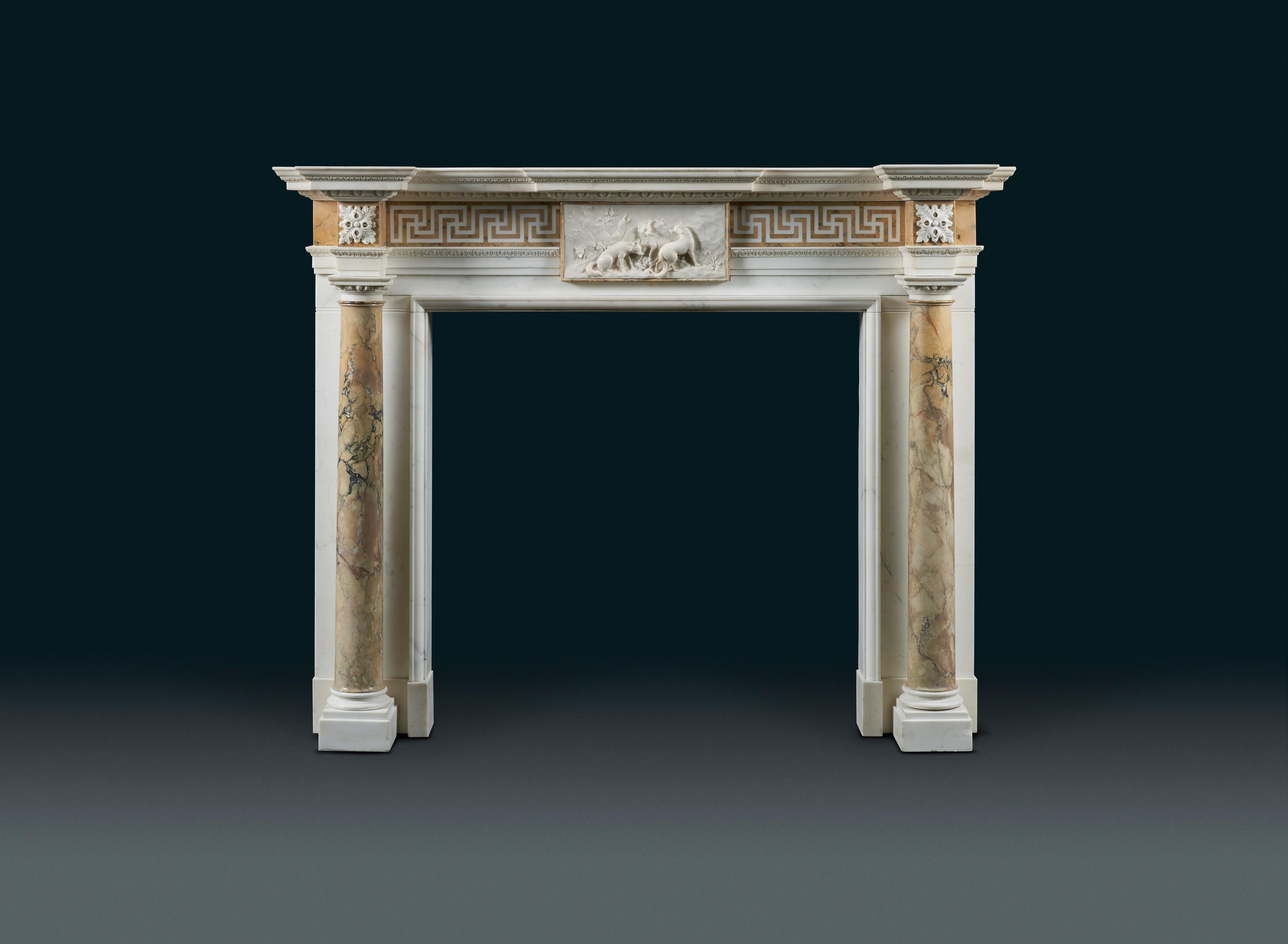 An imposing statuary marble fireplace with full rounded Siena marble columns, of 18th century Palladian style, after an original model by Sir Henry Cheere, most likely made in the 1770s after his workshop closed, possibly by one of his ex-employees.