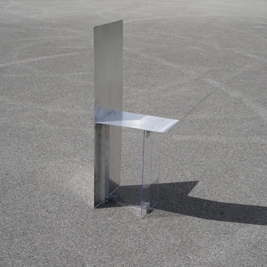 Imposter Chair by Undigested
Dimensions: L 170 x W 40 x H 70 cm
Material: Aluminum & Plexiglass

Imposter Chair, the captivating inaugural signature piece by Undigested. A mesmerizing fusion of acrylic materials and aluminum craftsmanship, this