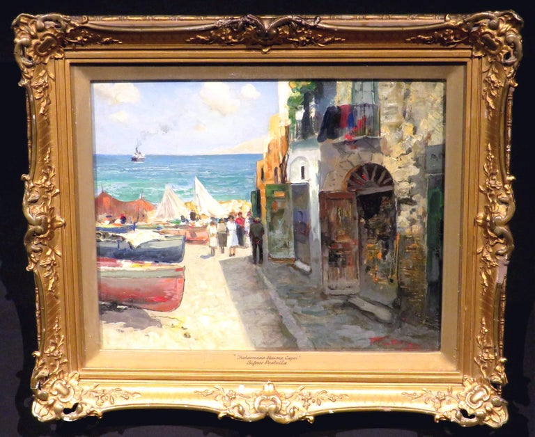 Oil on wood panel, signed bottom right and set in its original gilt gesso frame titled ‘Fishermen’s Houses, Capri’ together with the artists name in black script, fronted by a glazed panel. Titled & signed again in script on the reverse. The frame