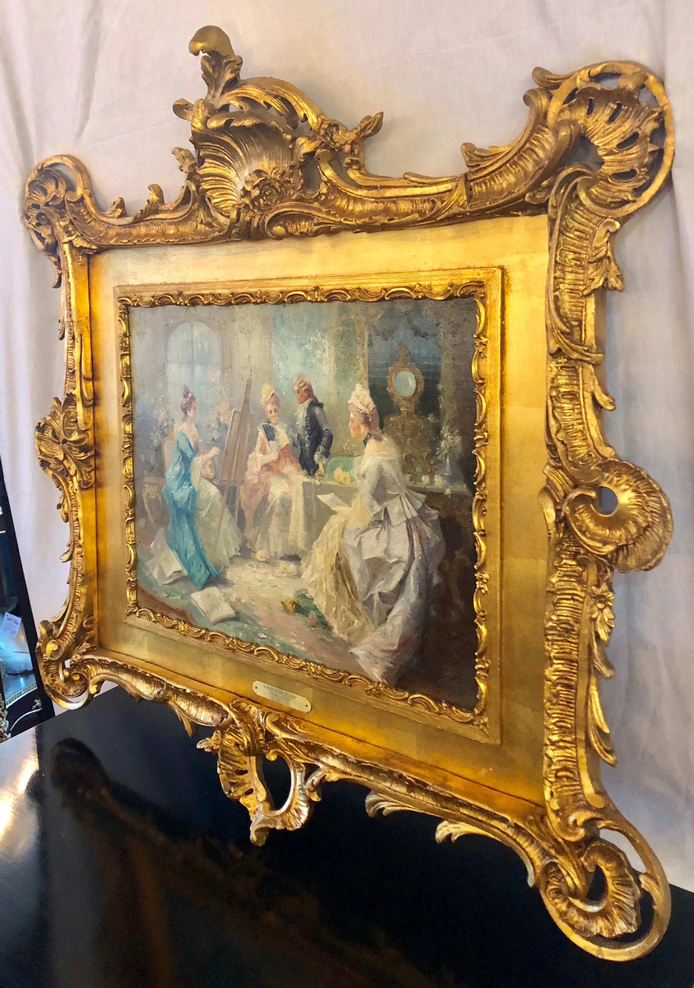 Impressionistic oil on board signed E Dorie Teissier titled 'A Visit in The Studio'. This wonderfully detailed and well thought out piece of art is set in the most spectacular gilt gold carved wooden frame anyone could ever ask for. The frame