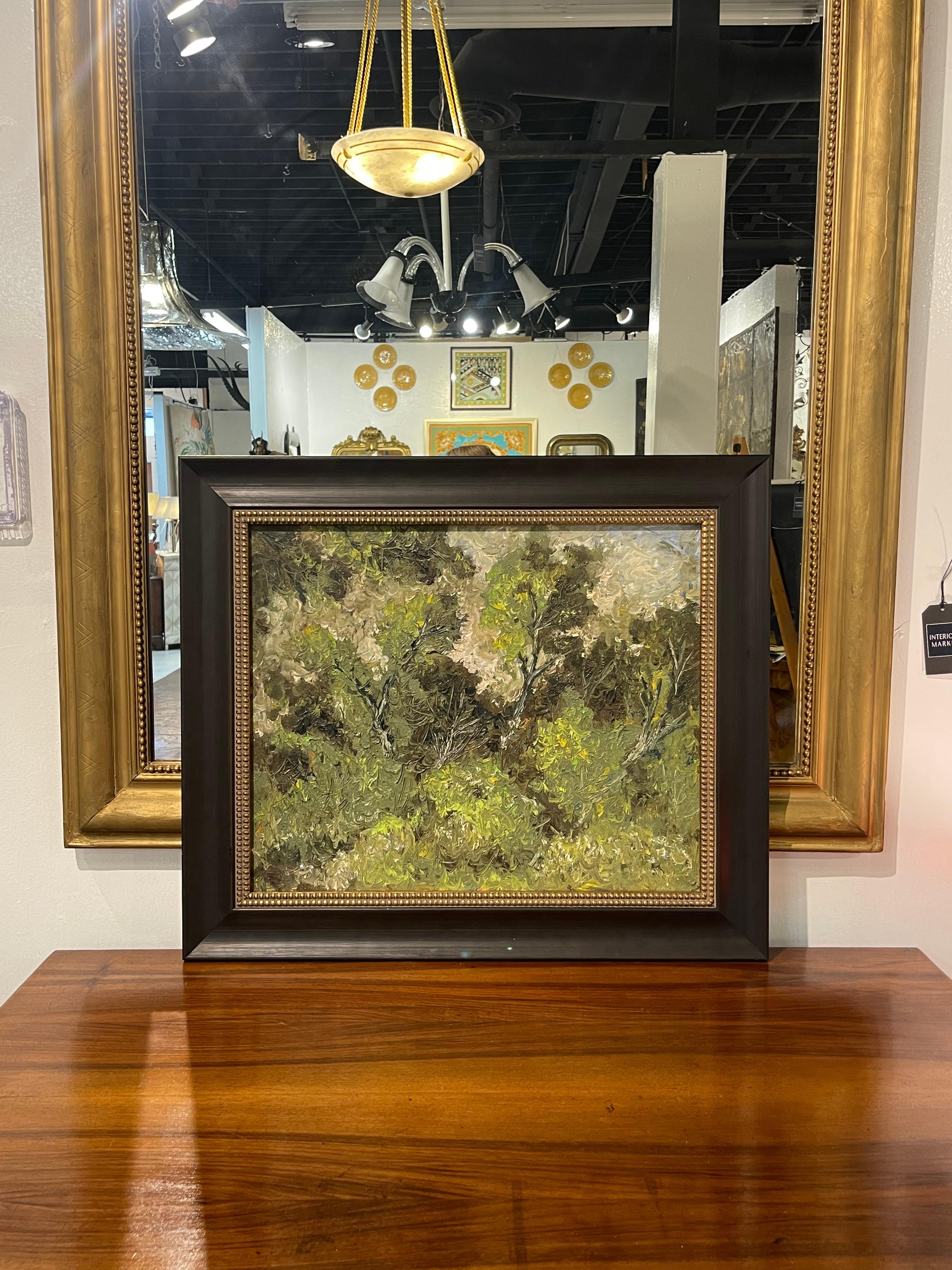 Vintage impressionistic heavily-textured painting on board of a wooded landscape set in a beautiful array of Spring green tones against a powder blue sky. 

The painting is held in a black lacquer frame with a gilt liner. The overall measurements