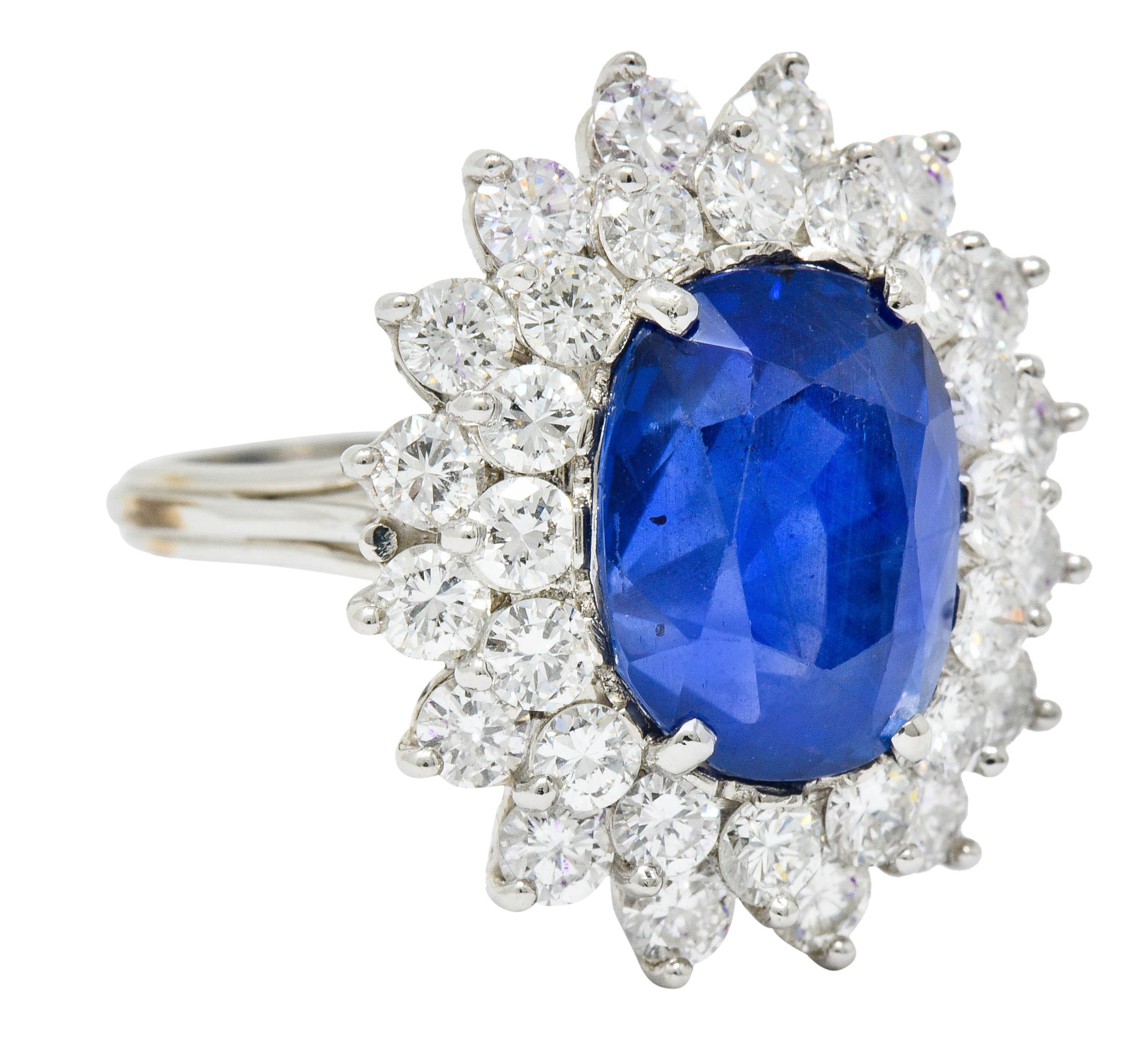 Centering an oval mixed cut Ceylon sapphire weighing 11.07 carats

Translucent and impressively blue in color with no indications of heat; Sri Lankan in origin

Surrounded by a double halo of round brilliant cut diamonds

Weighing in total