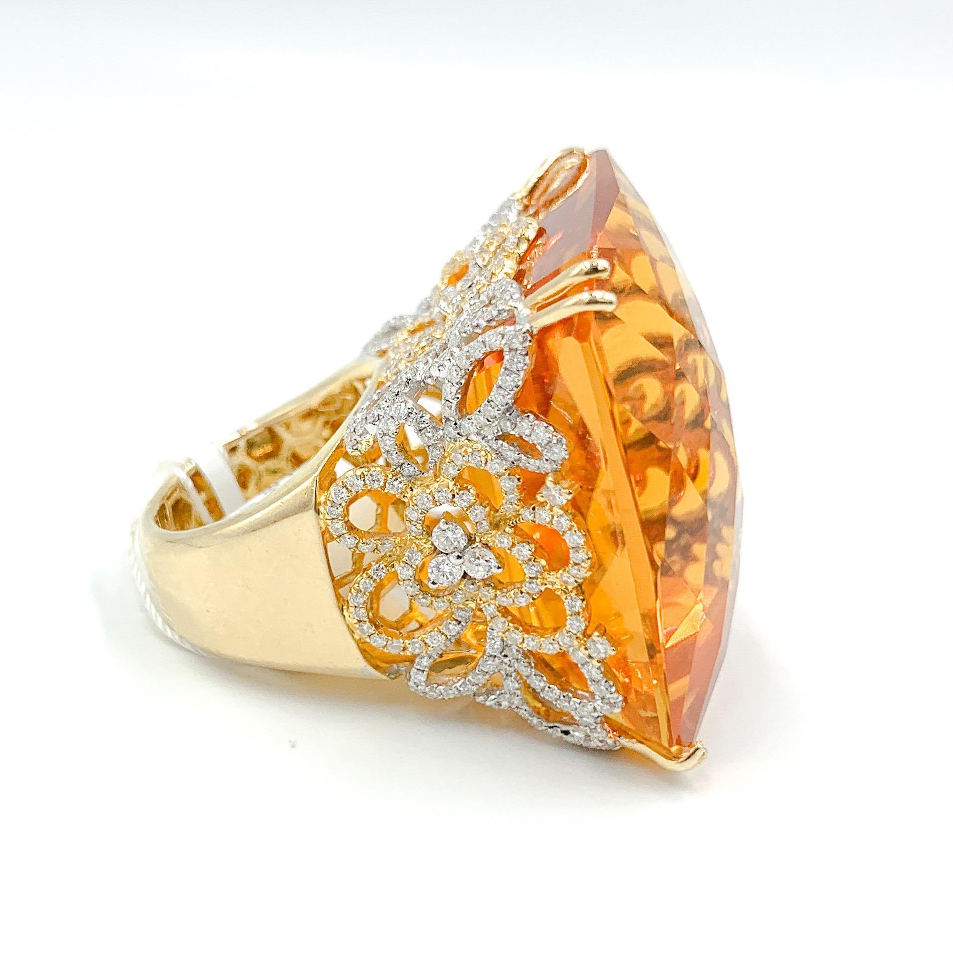 To say this ring is special would be an understatement. The sole focus of this one-of-a-kind piece is the 138 carat shield cut citrine that sits proudly in a crown of 18k white and yellow gold. The setting is adorned with 3.60 carats of F/G color,